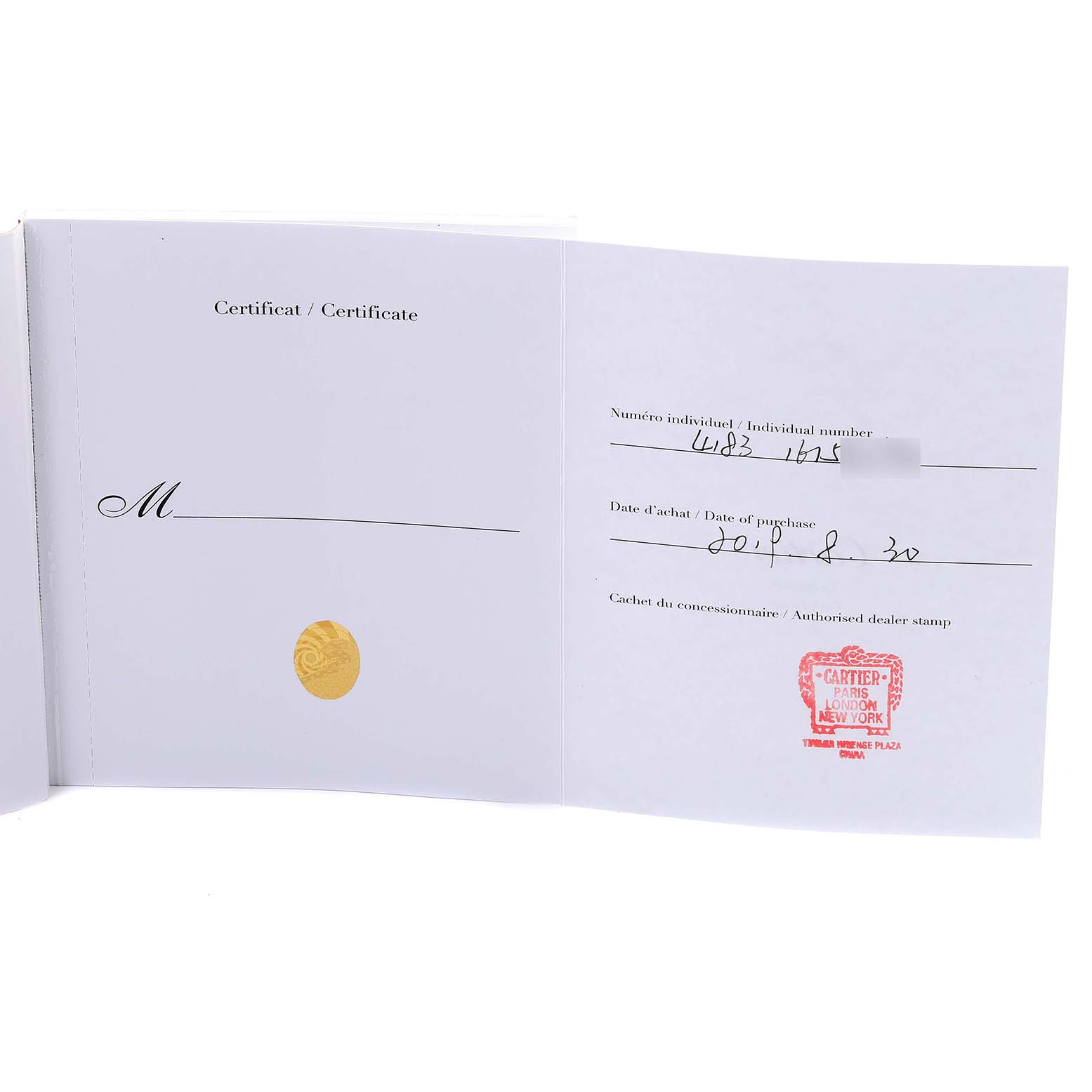 The image shows an open warranty certificate for the Cartier Santos WSSA0017 Men
s Stainless Steel Silver Dial WSSA0017 Men
s Stainless Steel Silver Dial model, featuring a serial number and dealer stamp.