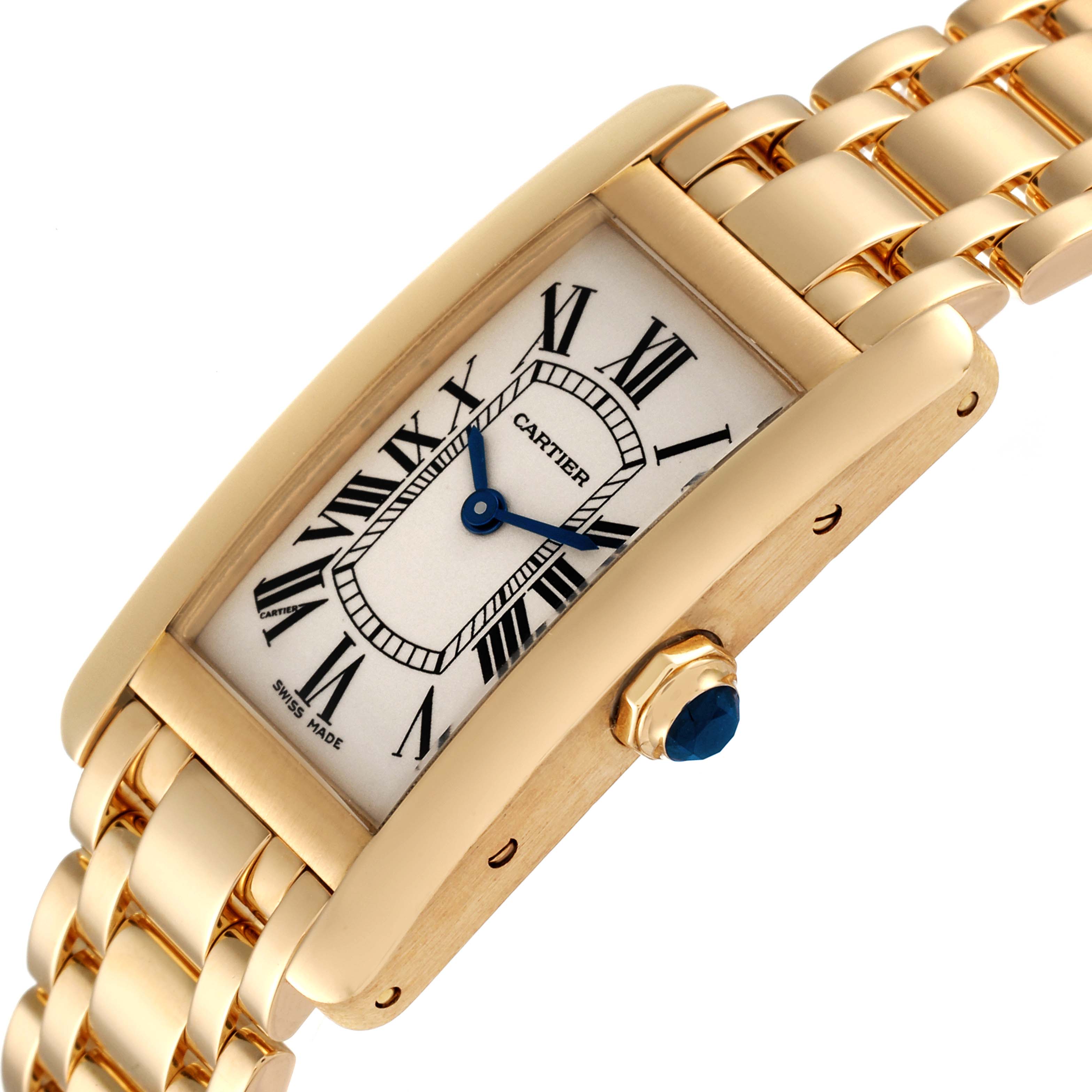 This image shows a close-up angled view of the Cartier Tank Americaine W26015K2 Women
s Yellow Gold Silver Dial W26015K2 Women
s Yellow Gold Silver Dial watch, highlighting the face, crown, and partial band.