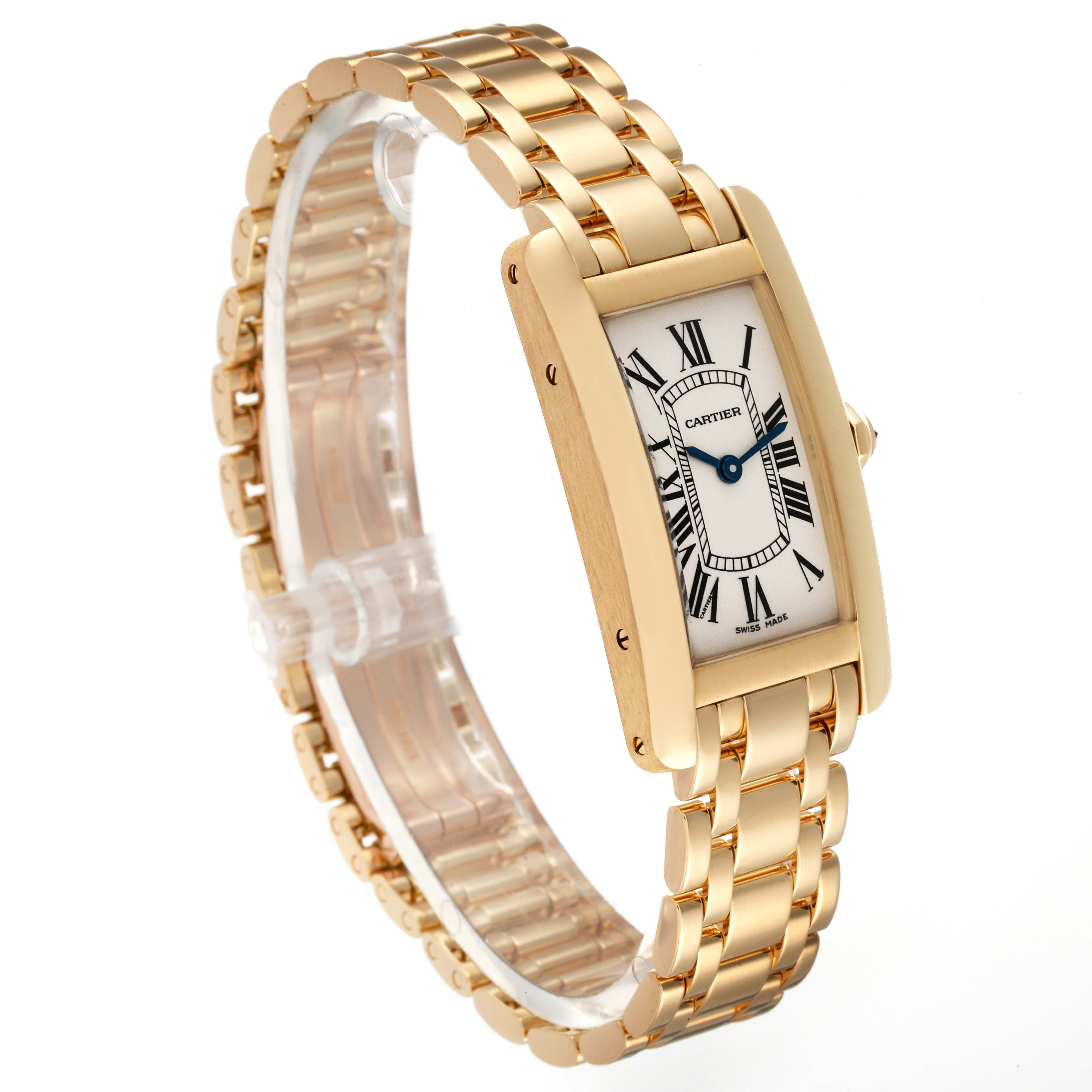 The image shows a Cartier Tank Americaine W26015K2 Women
s Yellow Gold Silver Dial W26015K2 Women
s Yellow Gold Silver Dial model watch at a slightly tilted angle, highlighting its face and gold bracelet.