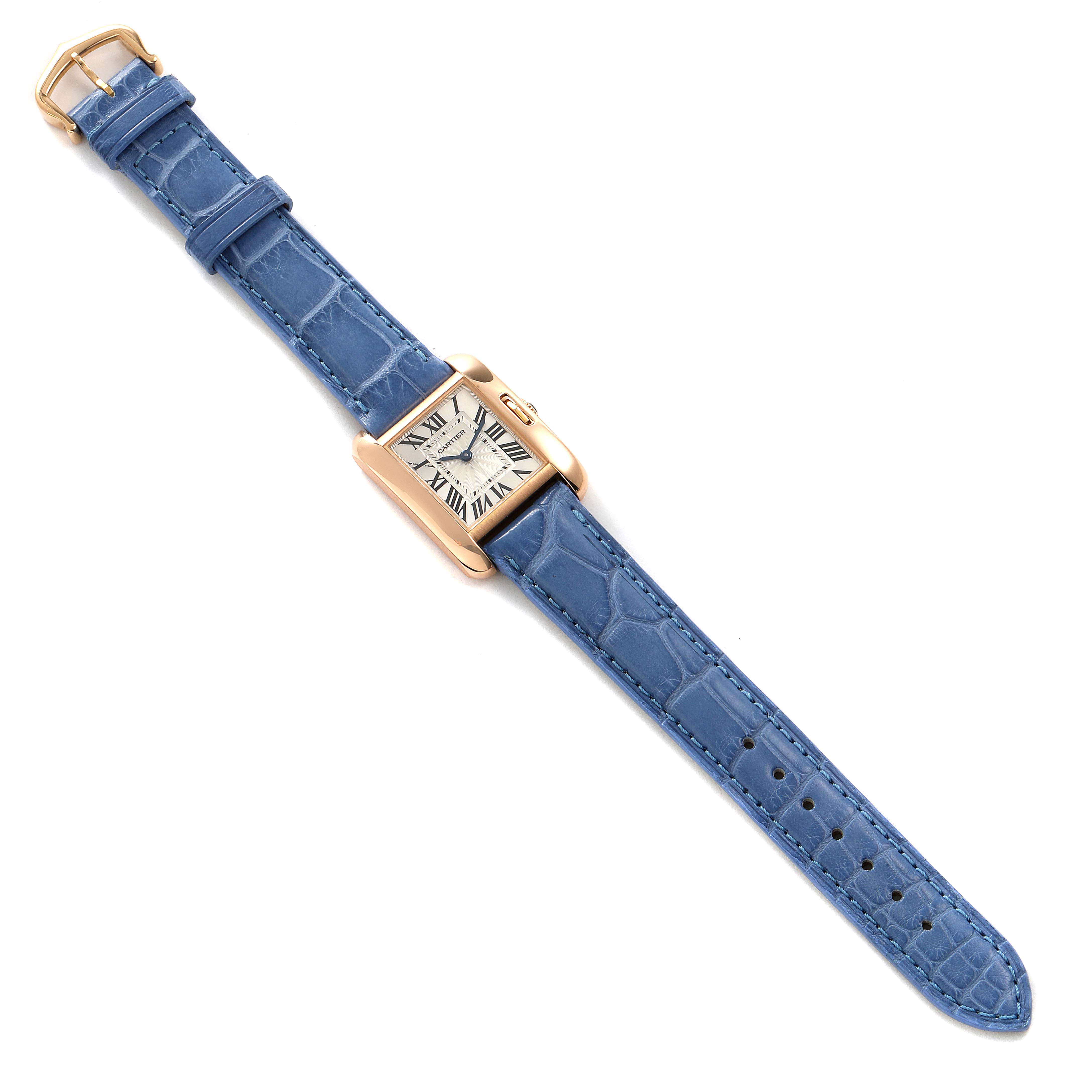 The image shows a Cartier Tank Anglaise WT100024 Women's Rose Gold Silver Dial WT100024 Women's Rose Gold Silver Dial watch, top view, displaying its blue leather strap and rectangular dial.