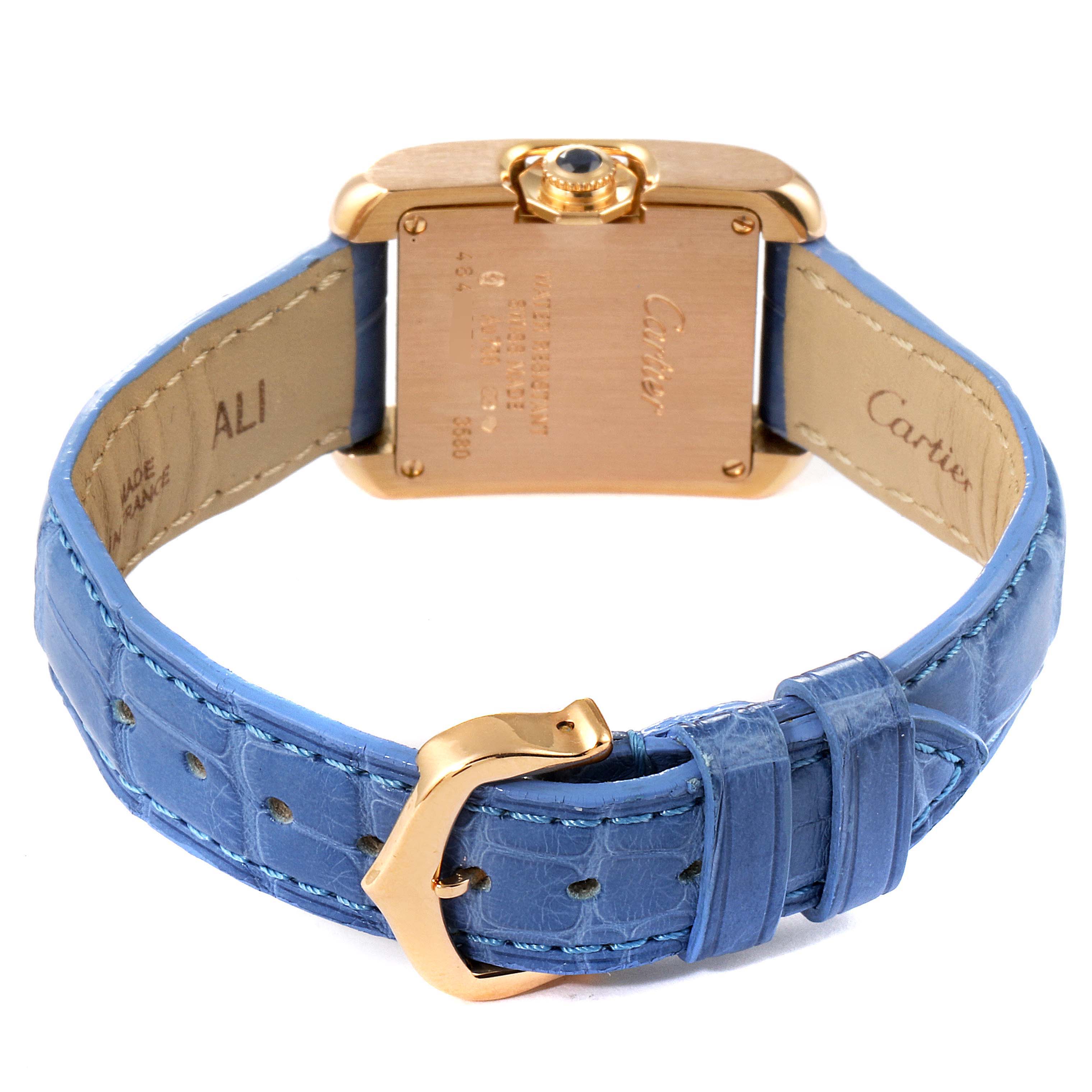 The image shows the back view of a Cartier Tank Anglaise WT100024 Women's Rose Gold Silver Dial WT100024 Women's Rose Gold Silver Dial watch, highlighting its blue leather strap and gold buckle.