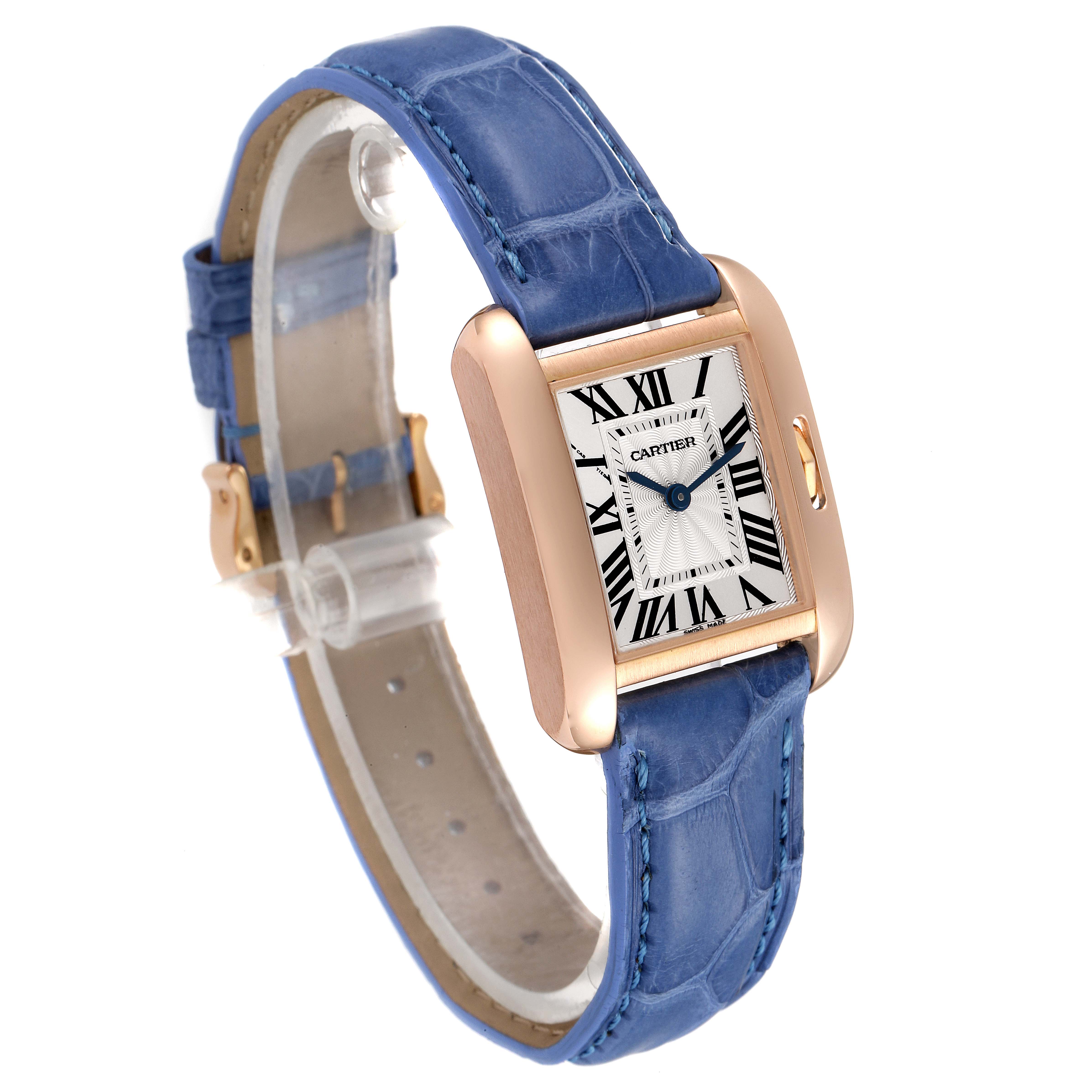 The image shows a Cartier Tank Anglaise WT100024 Women's Rose Gold Silver Dial WT100024 Women's Rose Gold Silver Dial watch at a three-quarter angle, featuring a blue leather strap and a rectangular gold case with a white dial.