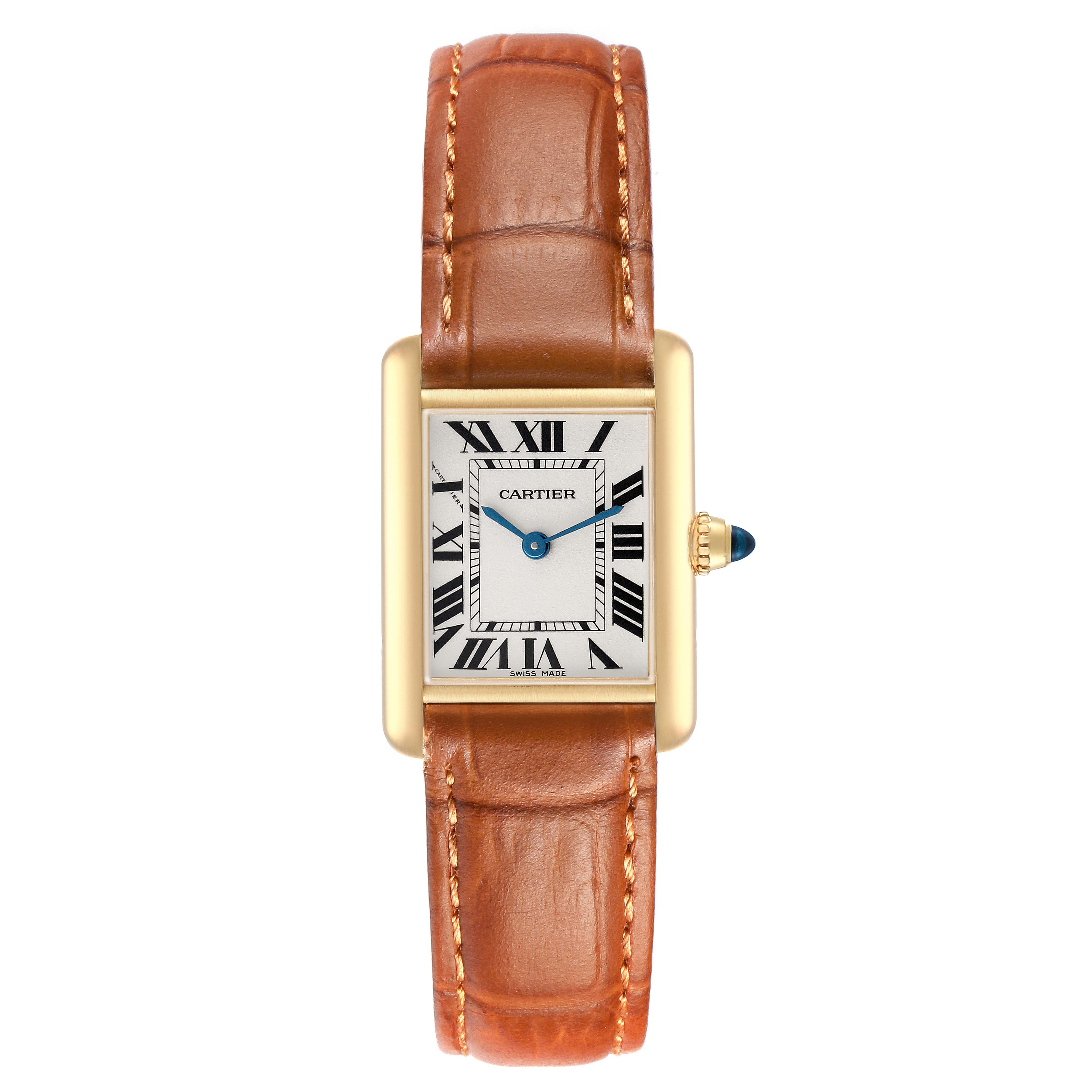 The Cartier Tank Louis W1529856 Women's Yellow Gold Silver Dial watch is shown from a top-down angle, displaying its rectangular face, Roman numerals, and brown leather strap.