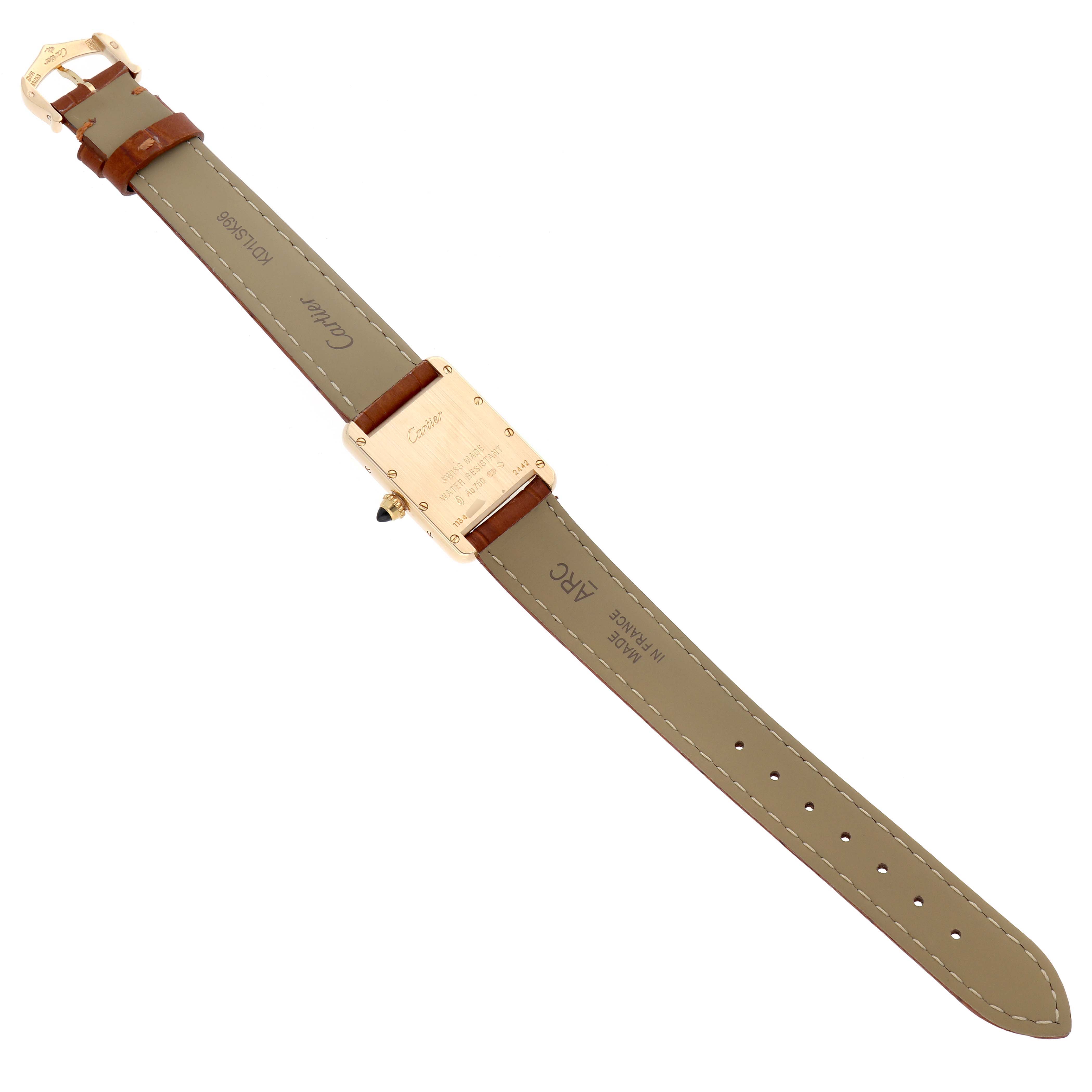 The Cartier Tank Louis W1529856 Women's Yellow Gold Silver Dial watch is shown from the back, displaying the case back and full leather strap.