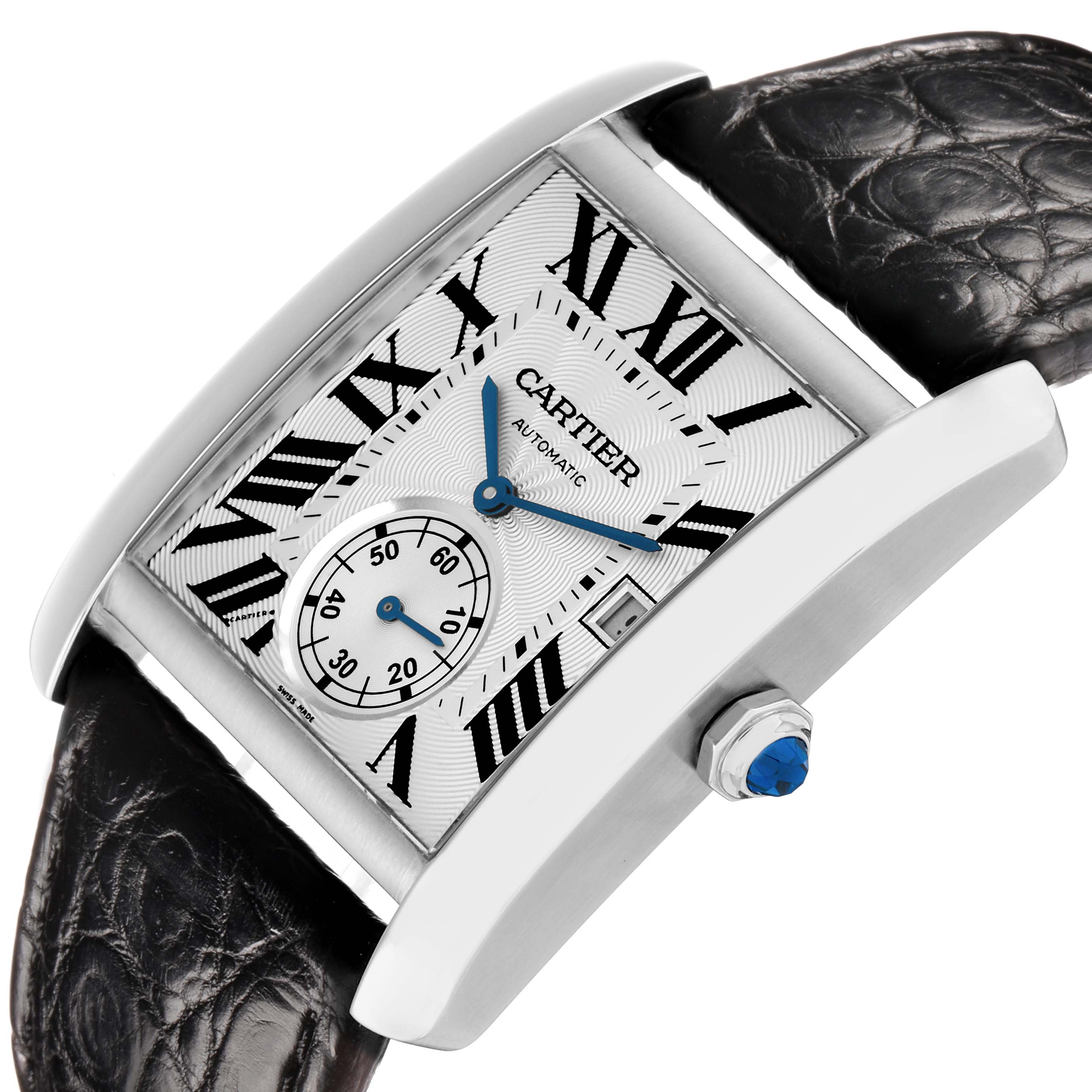 The Cartier Tank MC W5330003 Men
s Stainless Steel Silver Dial watch is shown at an angled view, highlighting the dial, Roman numerals, and crown with a blue cabochon.