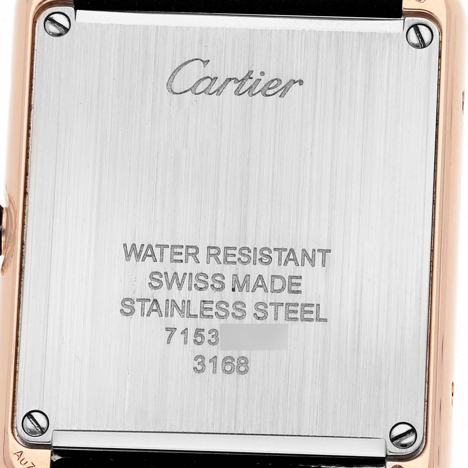 The image shows the back of the Cartier Tank Solo W5200024 Women's Rose Gold Silver Dial watch, highlighting its stainless steel case and engraved details.