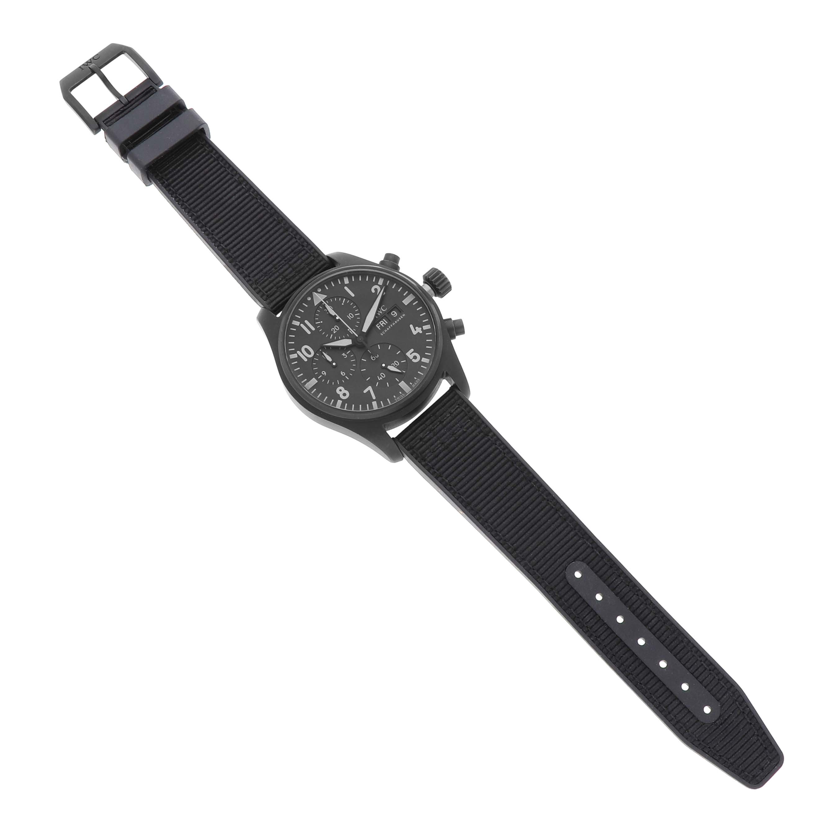 The IWC Pilot IW388106 Men's Ceramic Black Dial model watch is shown from a top-down angle, displaying its face, strap, buckle, and crown.