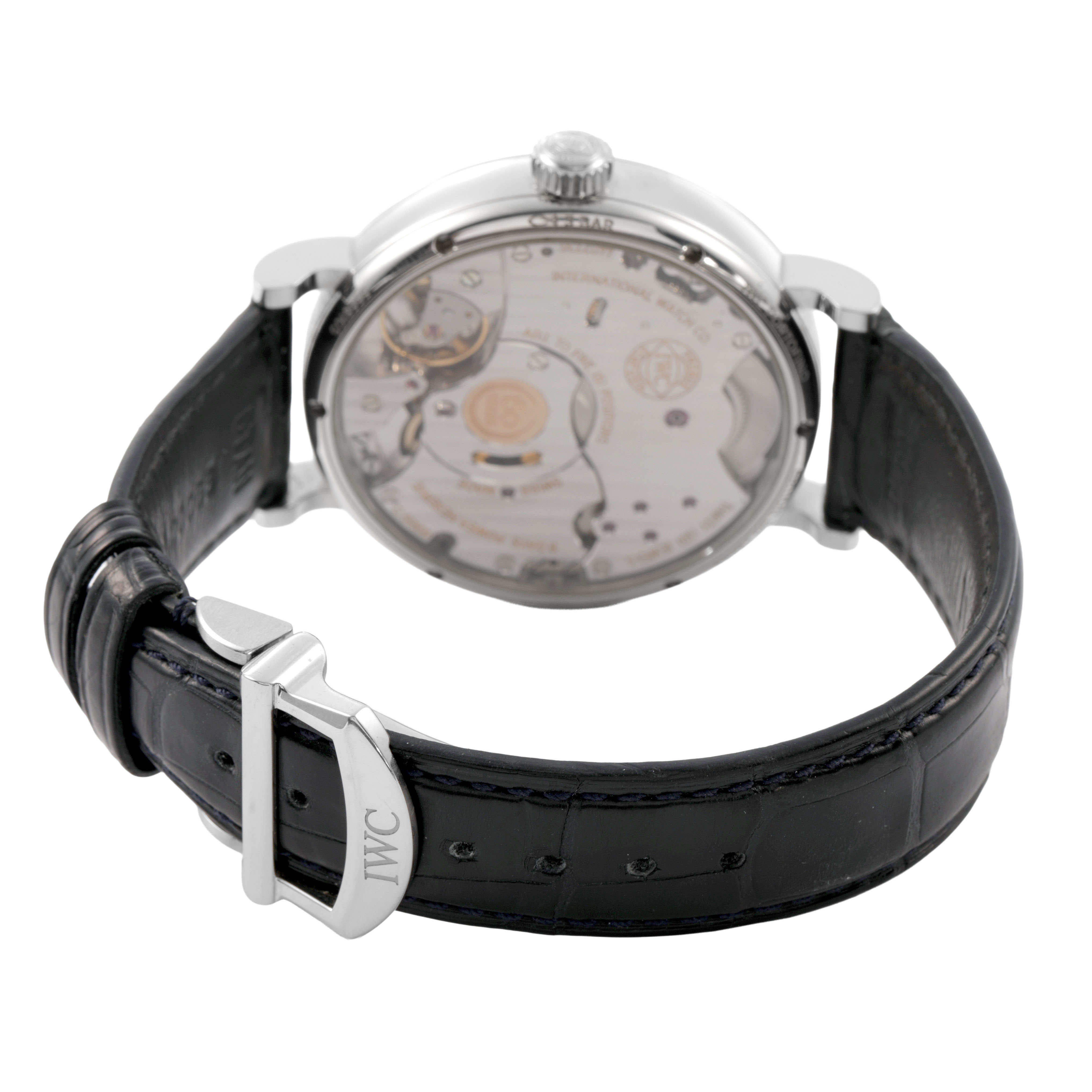 The IWC Portofino IW516406 Men's Stainless Steel White Dial watch is shown from the rear, highlighting the transparent case back and black leather strap with buckle.