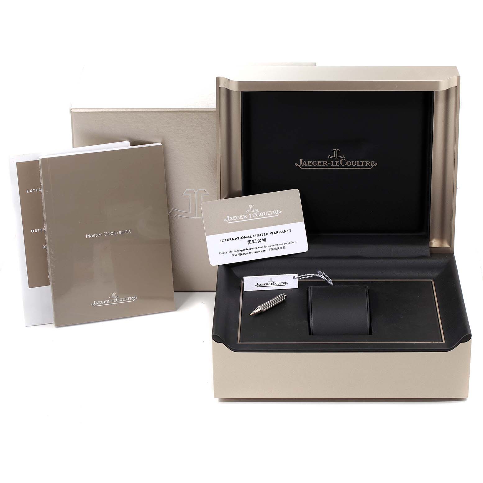 This image shows the Jaeger-LeCoultre Master watch box, manuals, warranty card, and a pen from a front angle.
