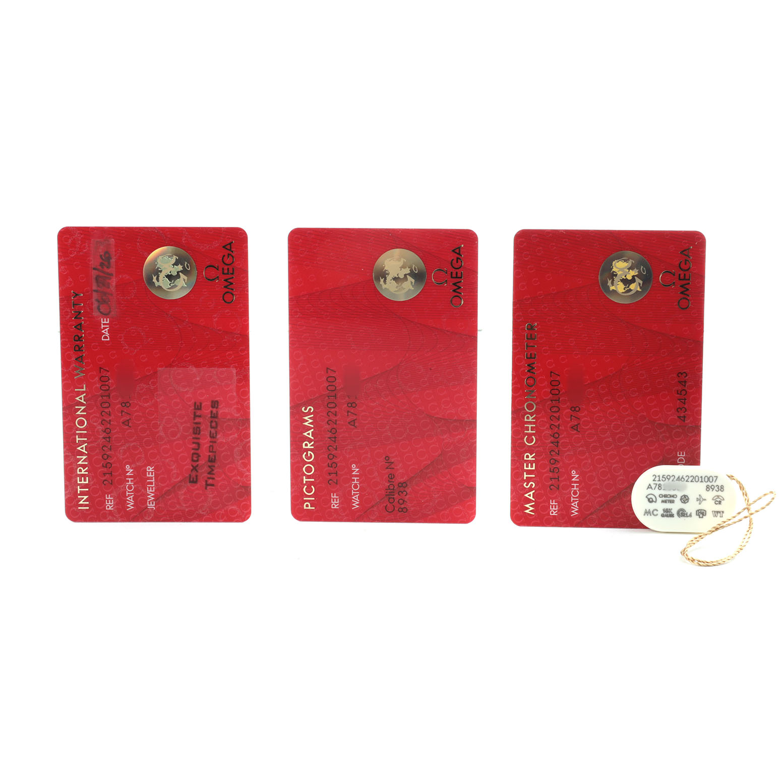 The image shows three red cards: International Warranty, Pictograms, and Master Chronometer, for the Omega Planet Ocean 215.92.46.22.01.007 Men's Ceramic Black Dial model, plus a tag.