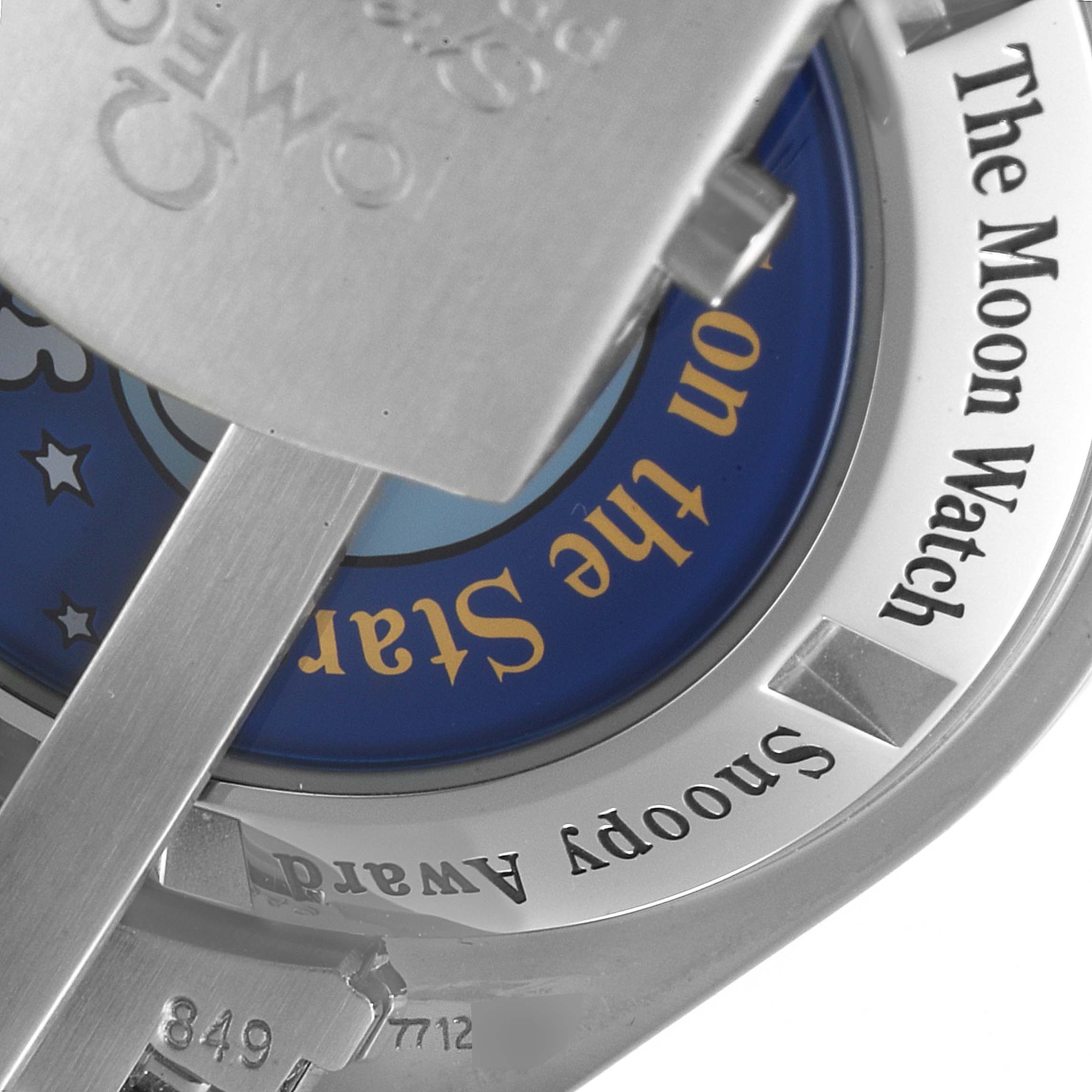 The image shows a close-up of the case back of the Omega Speedmaster 3578.51.00 Men's Stainless Steel Black Dial 3578.51.00 Men's Stainless Steel Black Dial, featuring “The Moon Watch” and “Snoopy Award” inscriptions.