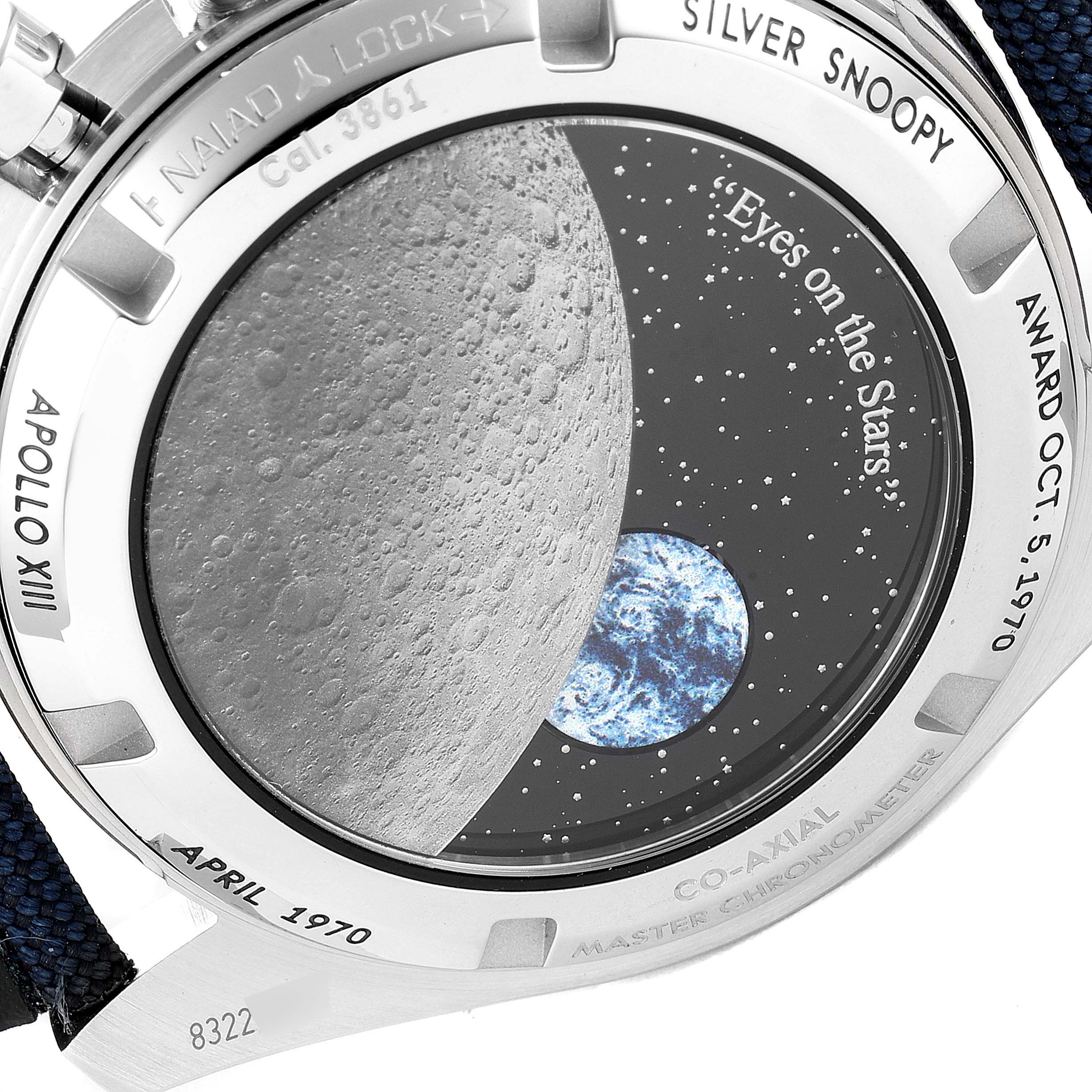 The image shows the caseback of the Omega Speedmaster 310.32.42.50.02.001 Men's Stainless Steel Silver Dial 310.32.42.50.02.001 Men's Stainless Steel Silver Dial "Silver Snoopy Award" edition, featuring lunar and Earth graphics.