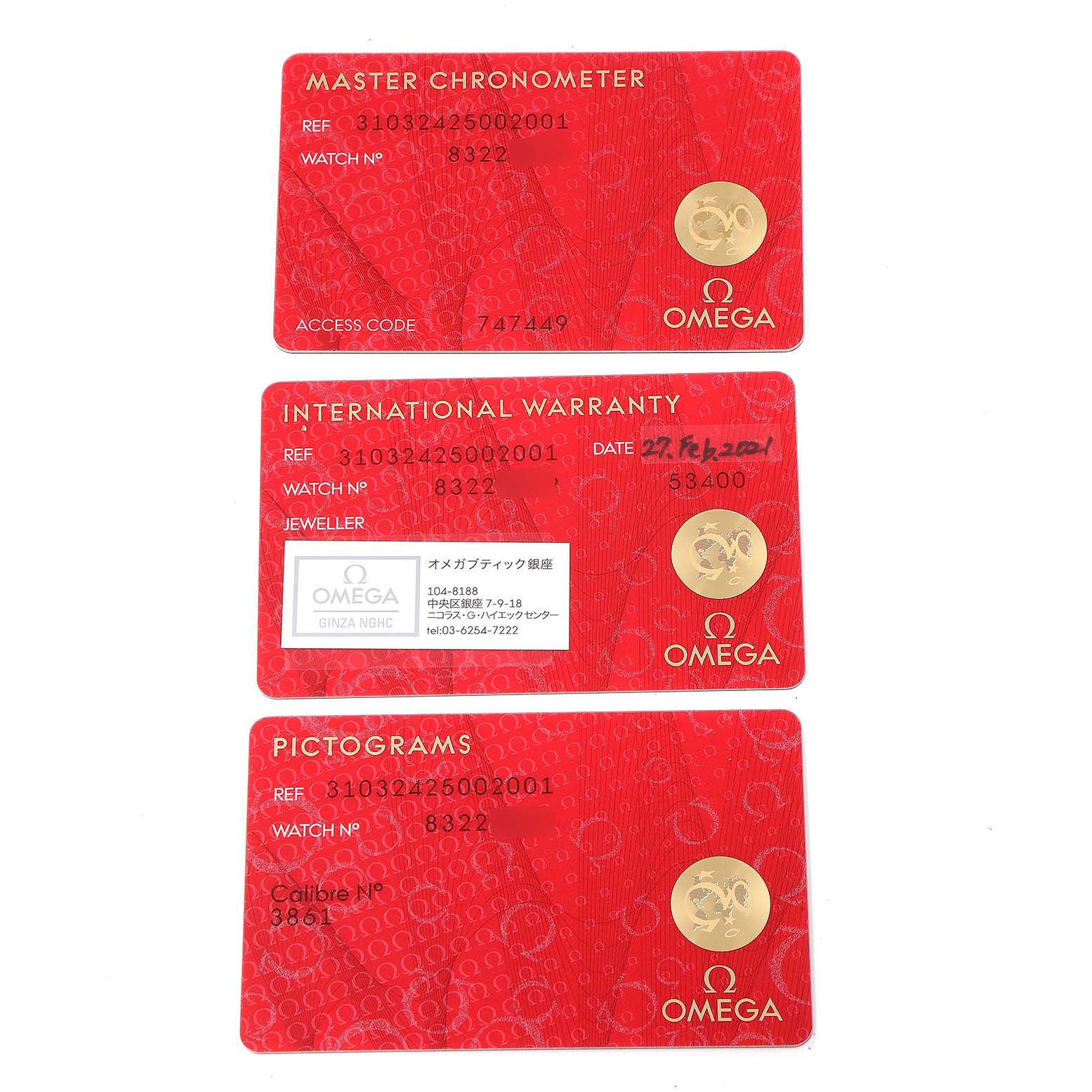 The image shows three Omega cards for the Speedmaster model: Master Chronometer, International Warranty, and Pictograms.