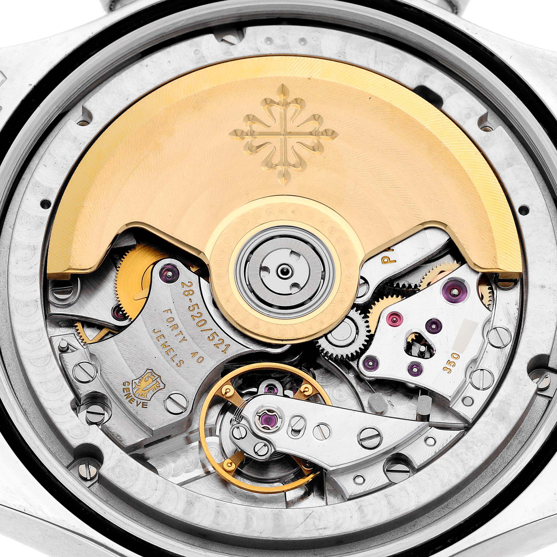 The image shows the intricate movement and rotor mechanism of a Patek Philippe Complications 5960P-001 Men's Platinum Grey Dial 5960P-001 Men's Platinum Grey Dial watch from a back view.