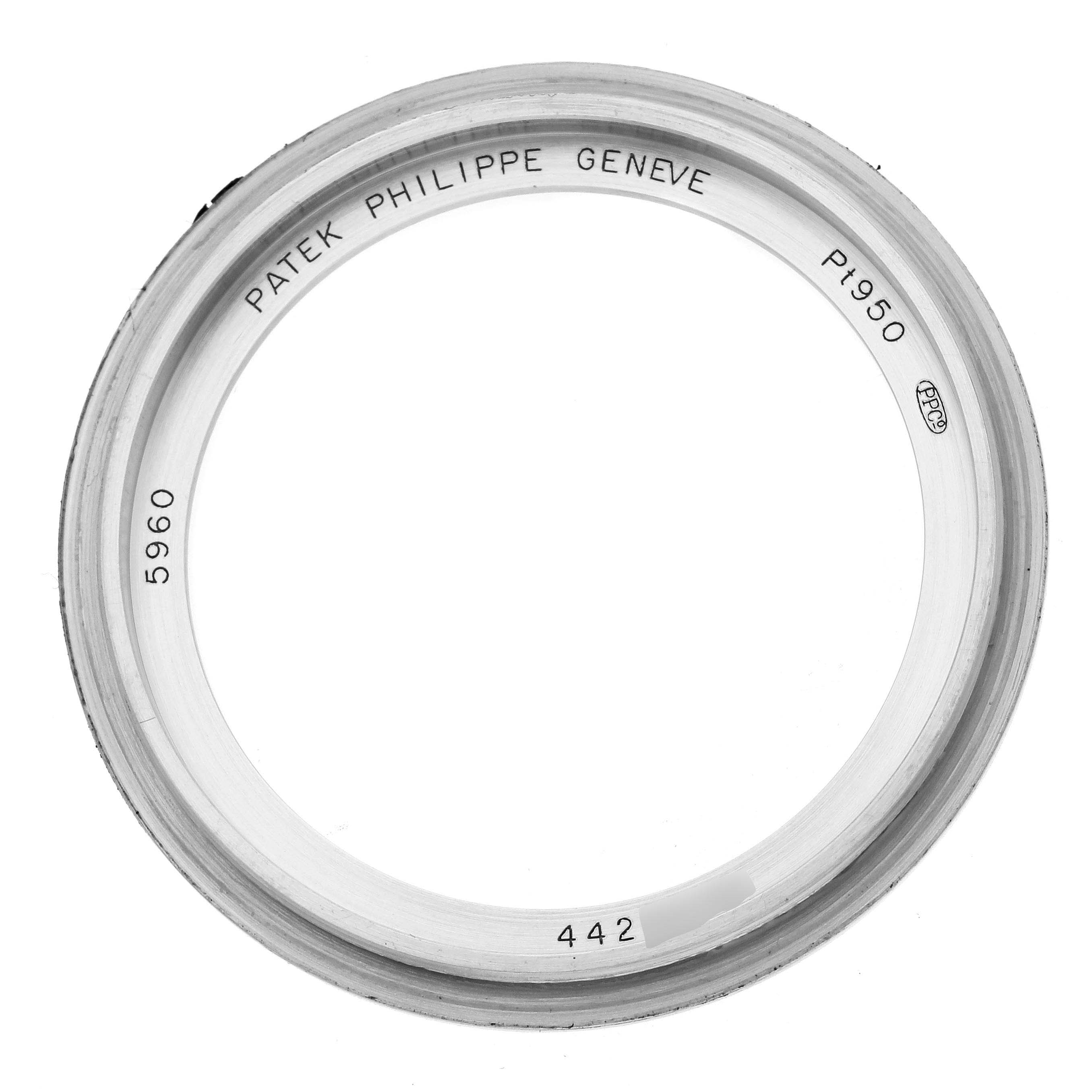 The image shows a top view of a bezel from a Patek Philippe Complications 5960P-001 Men's Platinum Grey Dial 5960P-001 Men's Platinum Grey Dial model.