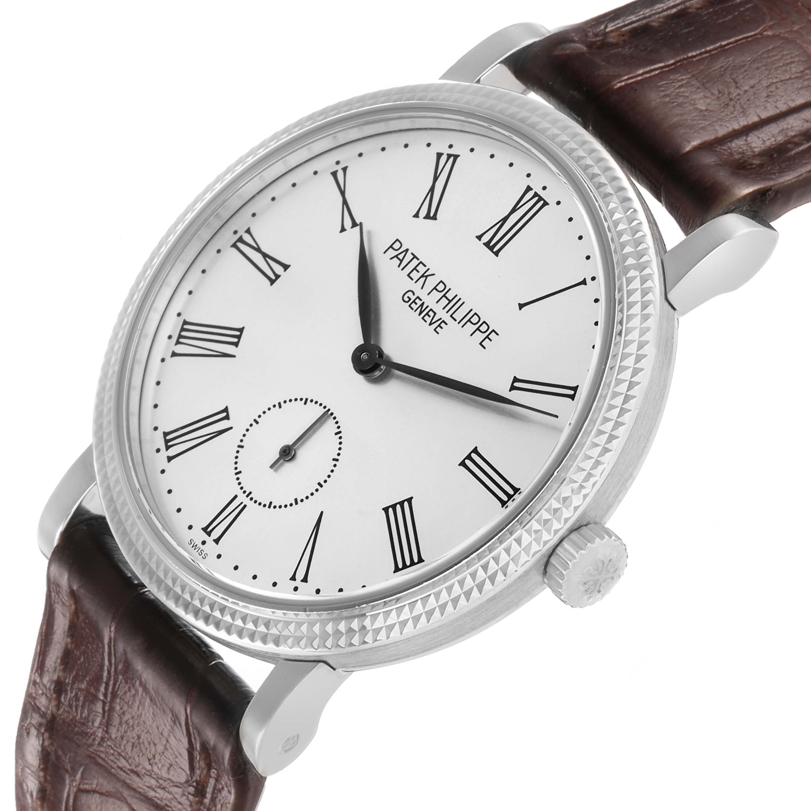 The Patek Philippe Calatrava 7119G Women
s White Gold White Dial watch is shown from a slight top-side angle, highlighting the face, bezel, crown, and leather strap.