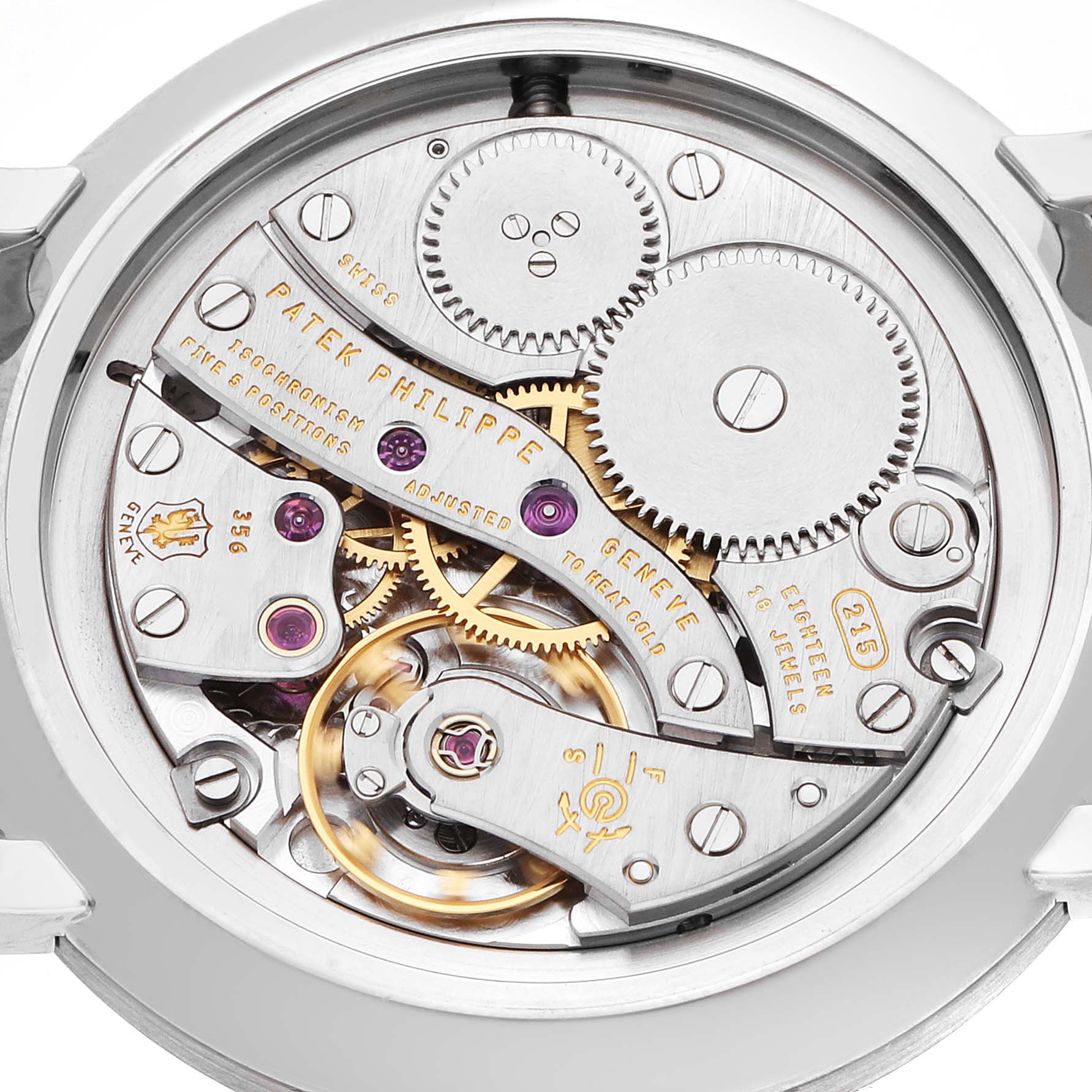The image shows the movement mechanism of a Patek Philippe Calatrava 7119G Women
s White Gold White Dial watch from the back, showcasing gears and jewels.