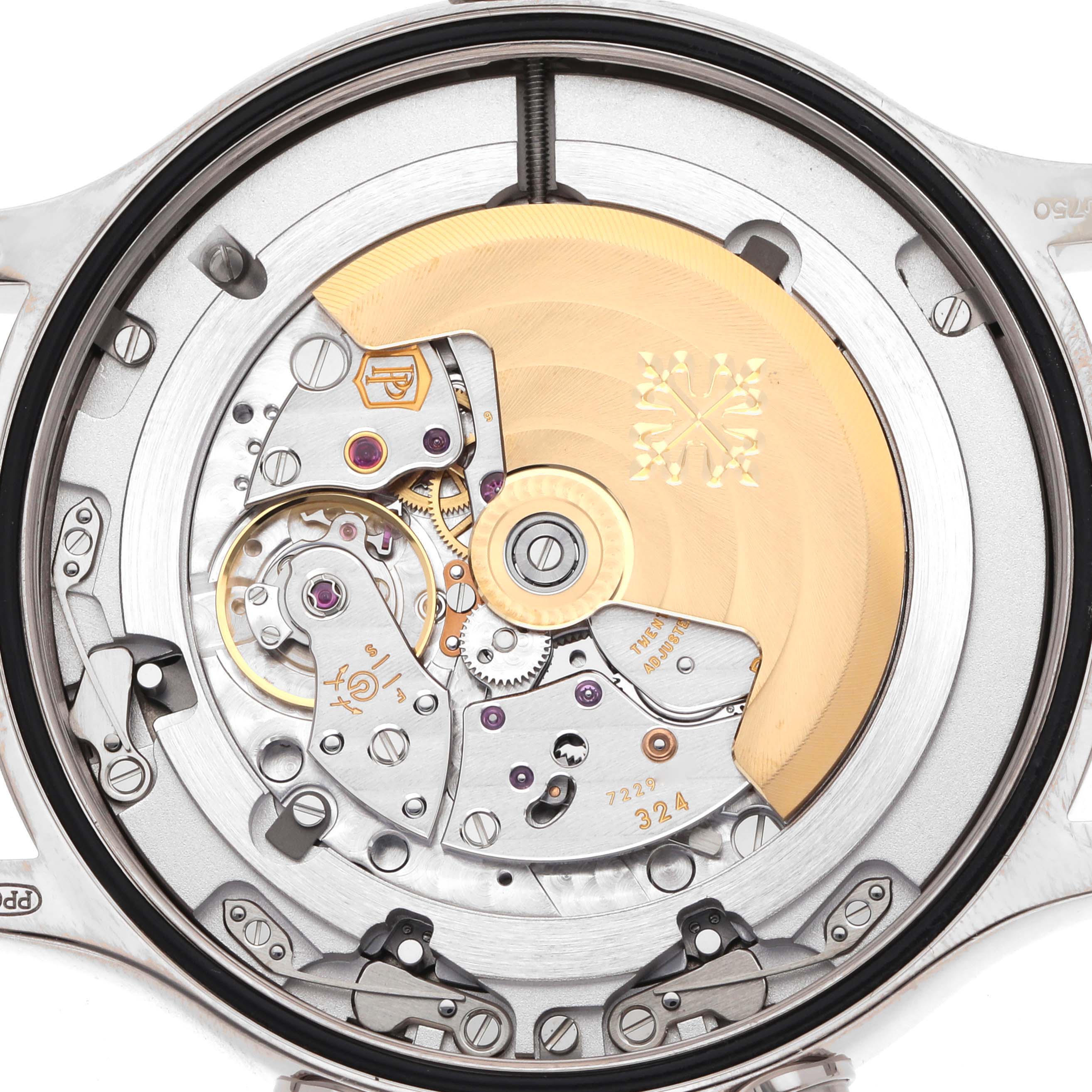 The image shows the back view of a Patek Philippe Calatrava 5524G-001 Men
s White Gold Blue Dial, highlighting its intricate movement and rotor.