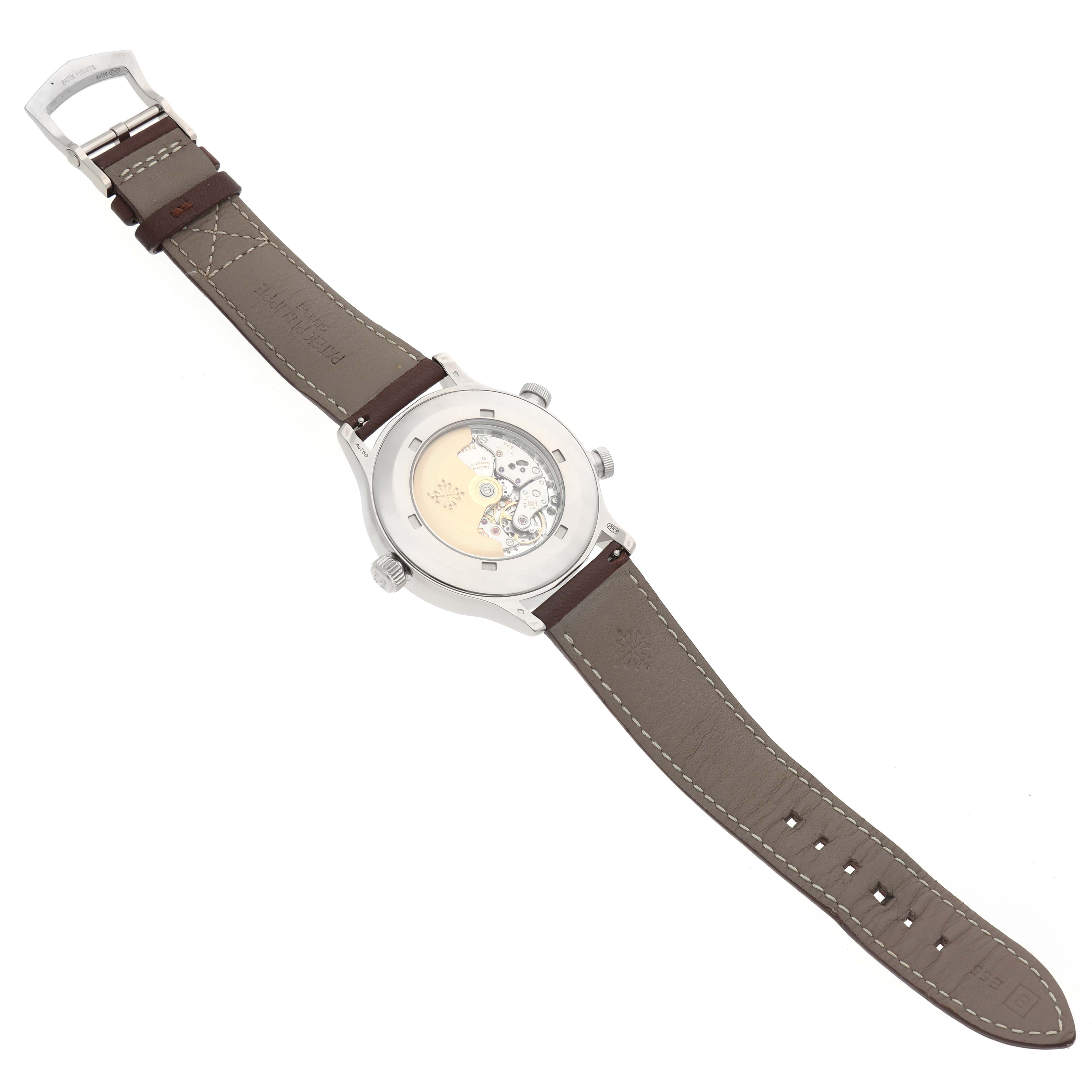 The Patek Philippe Calatrava 5524G-001 Men
s White Gold Blue Dial watch is shown from the back, highlighting its transparent case back and leather strap.