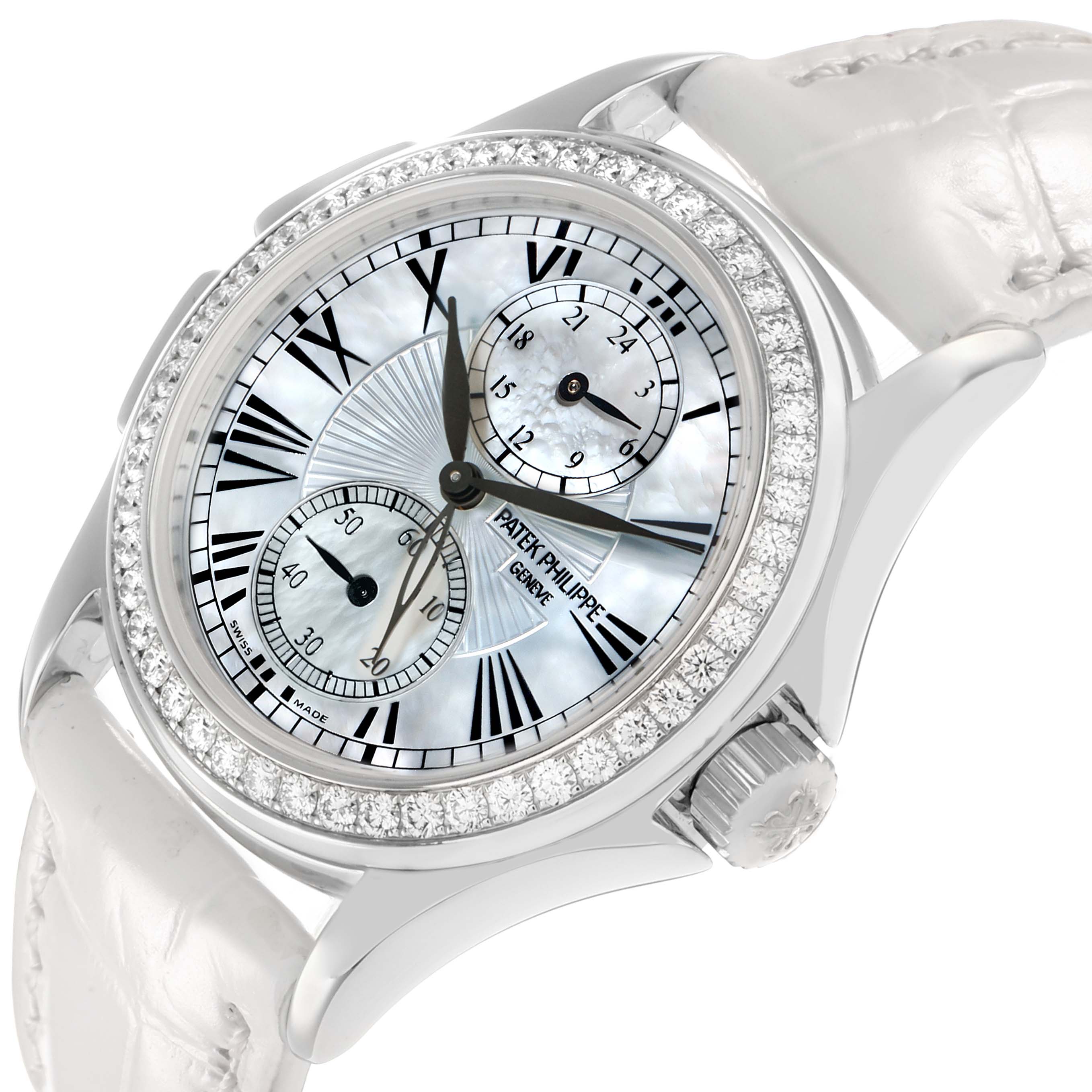The Patek Philippe Calatrava 4934G-001 Women
s White Gold Mother of Pearl Dial watch is shown at a tilted angle, highlighting the dial, subdials, bezel with diamonds, and crown.