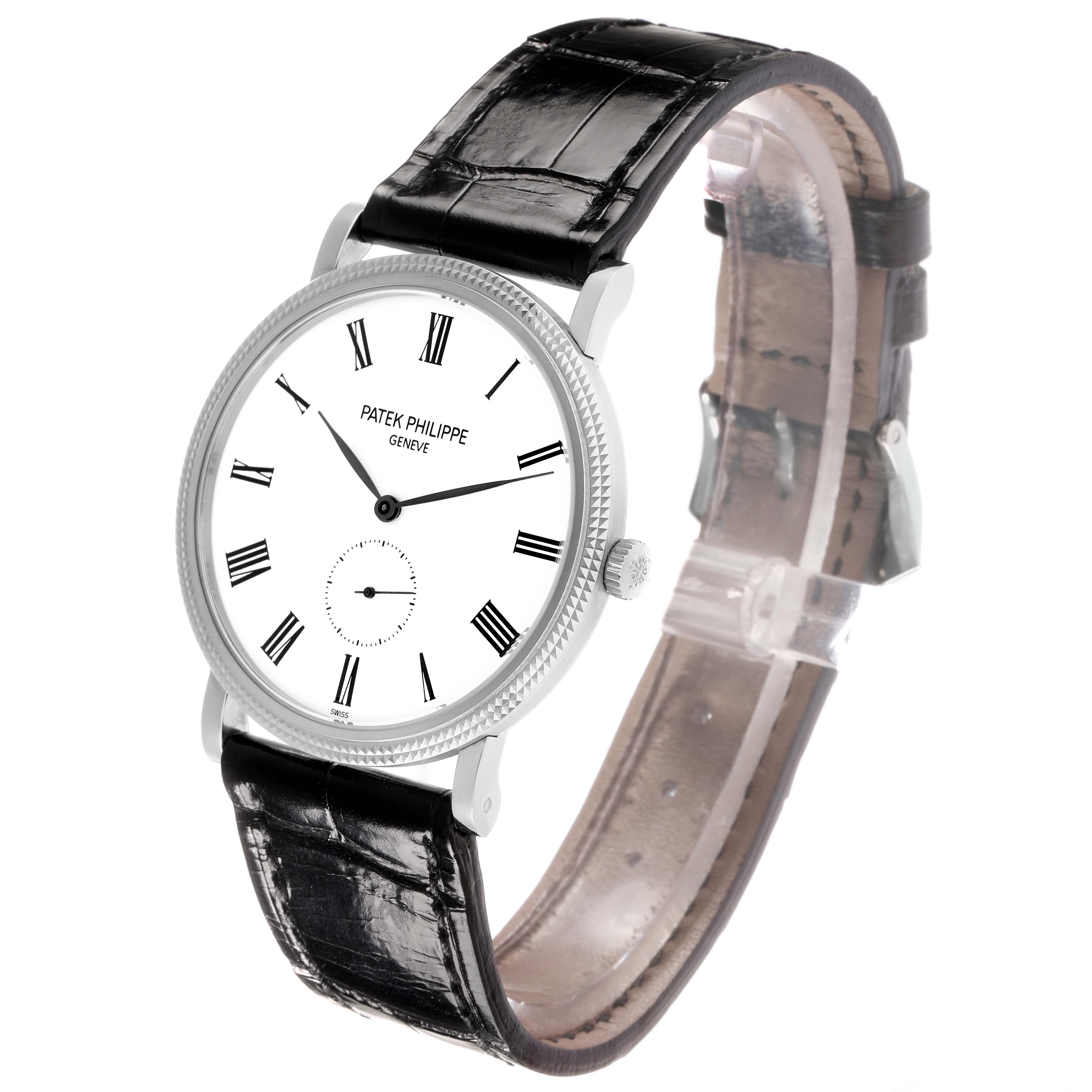 The image shows a Patek Philippe Calatrava 5119G-001 Men
s White Gold White Dial watch at a front-side angle, highlighting the dial, bezel, crown, and black leather strap.