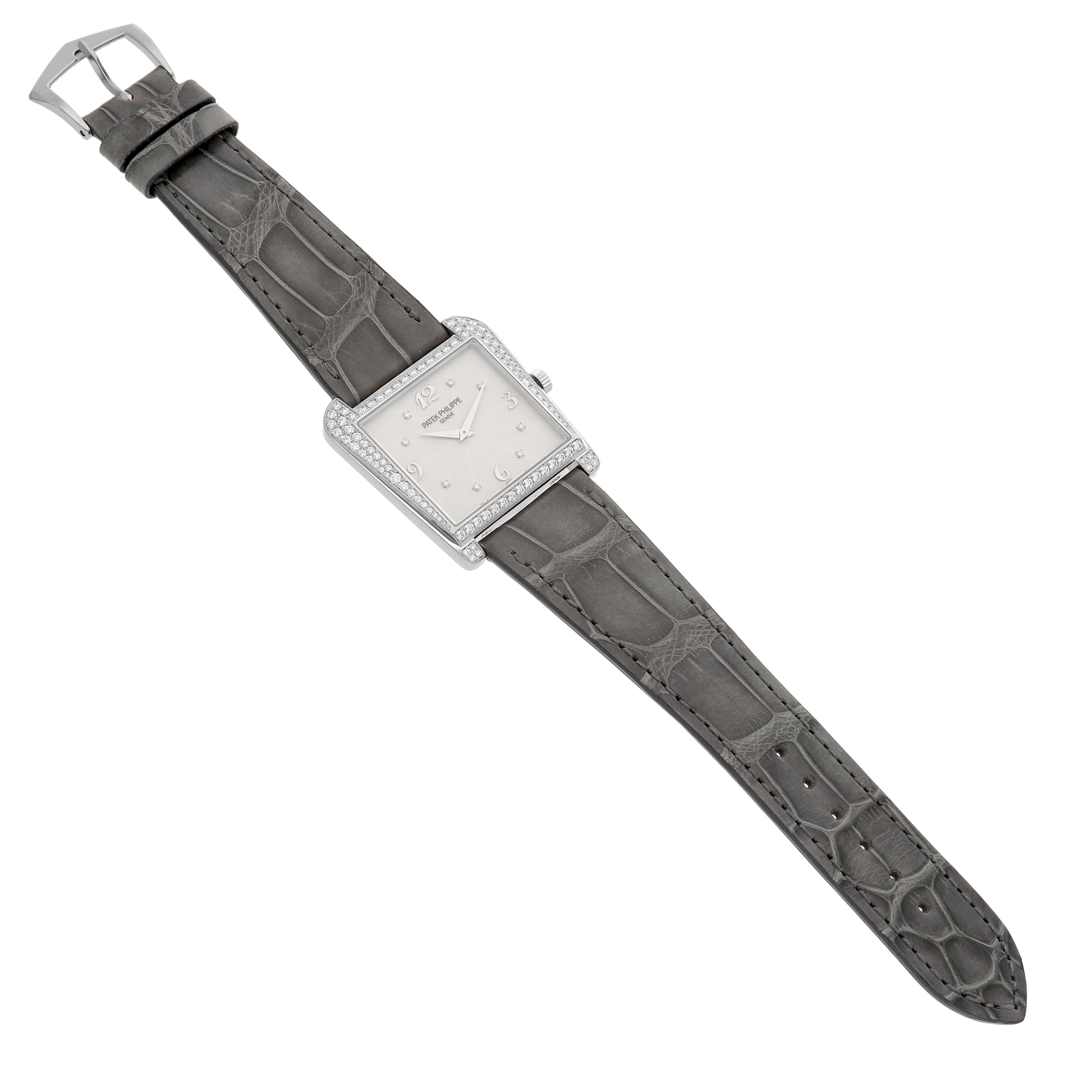 The Patek Philippe Calatrava 4888G-001 Women's White Gold Silver Dial watch is shown angled from above, displaying its square dial, bezel, and leather strap.