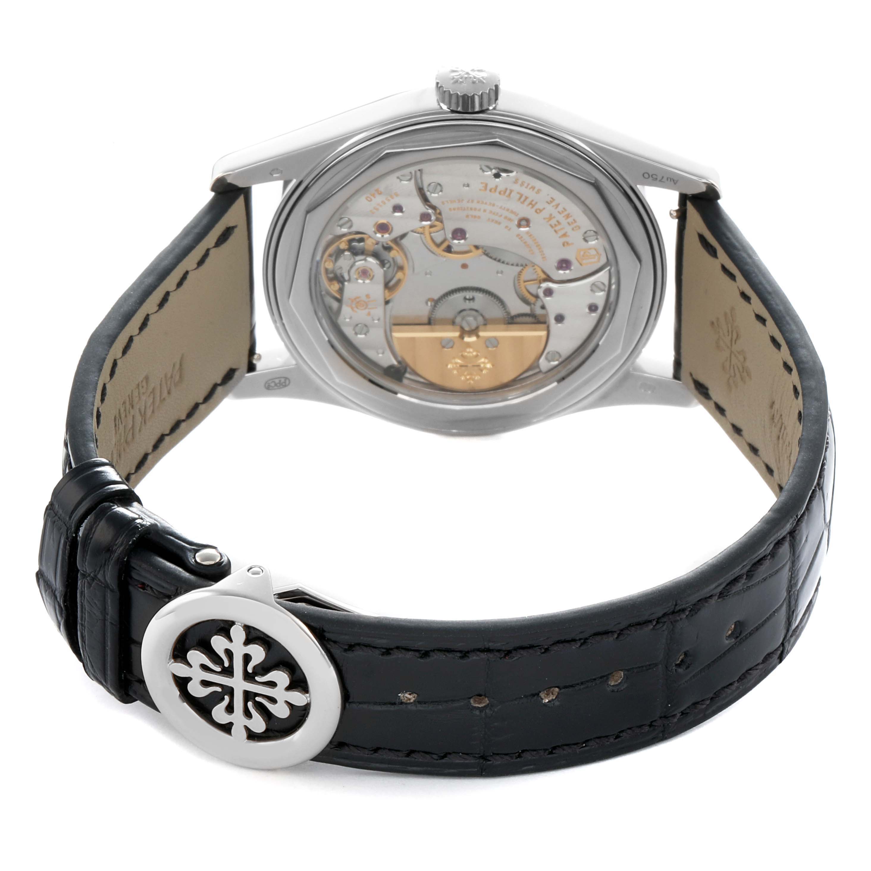 The image shows the back view of the Patek Philippe Calatrava 6000G Men
s White Gold Blue Dial, highlighting the movement and strap clasp.