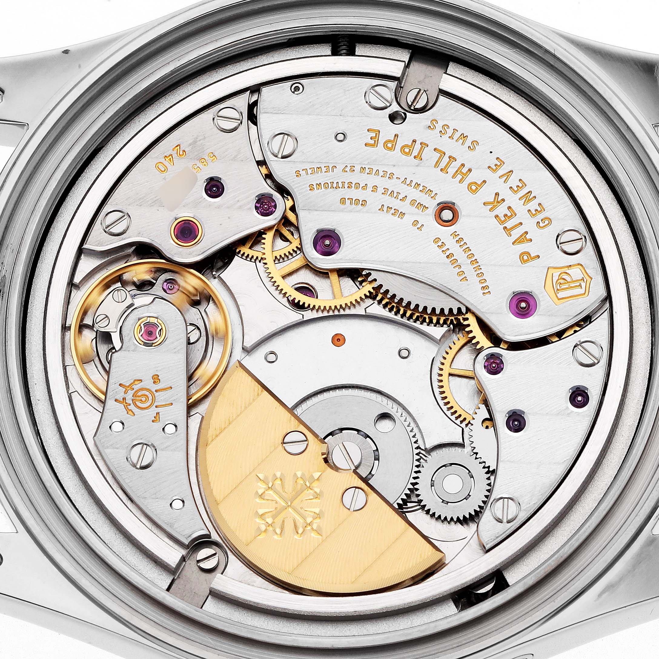 The image shows the open case back of a Patek Philippe Calatrava 6000G Men
s White Gold Blue Dial, revealing its intricate mechanical movement and gears.