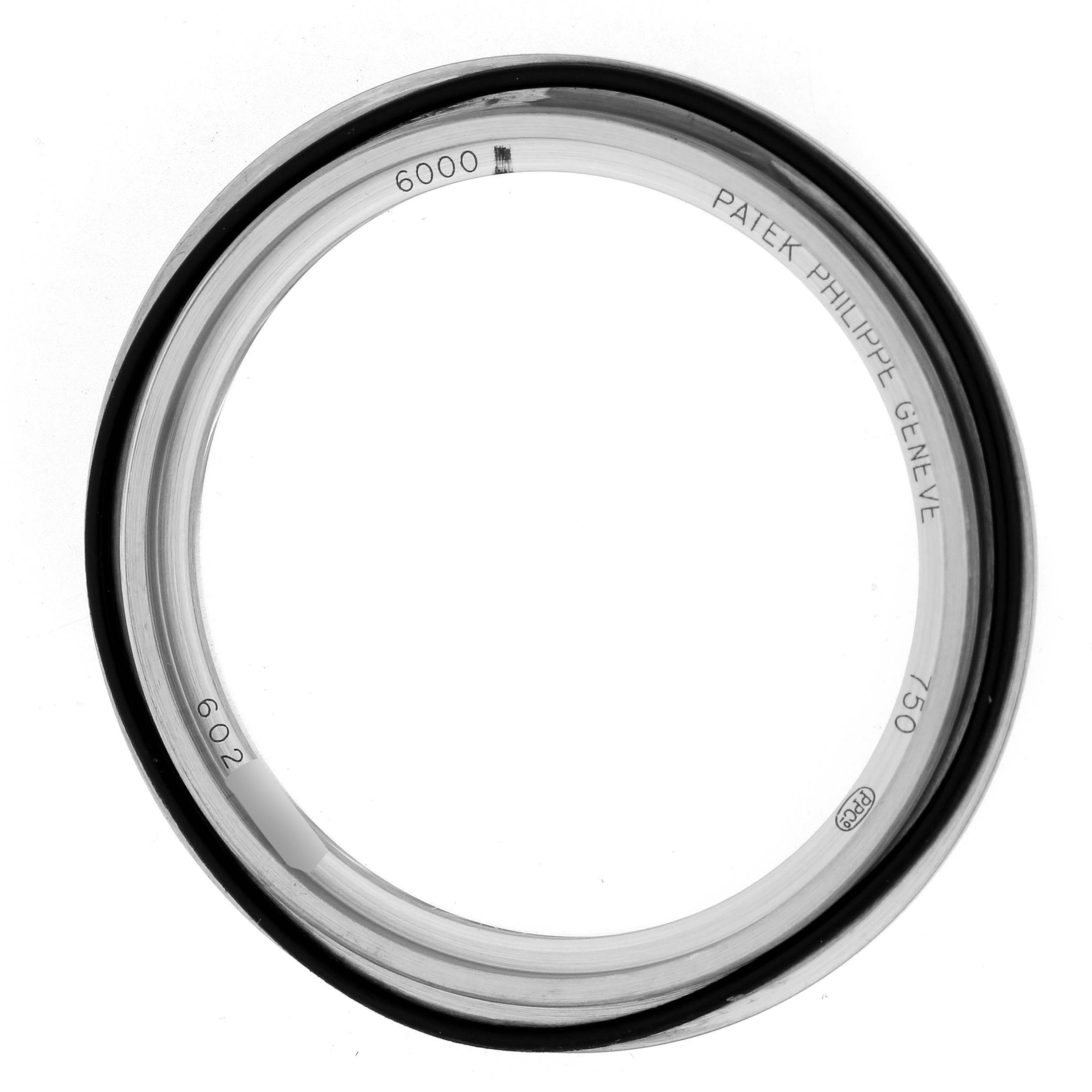 This image shows the bezel of a Patek Philippe Calatrava 6000G Men
s White Gold Blue Dial watch viewed from above.