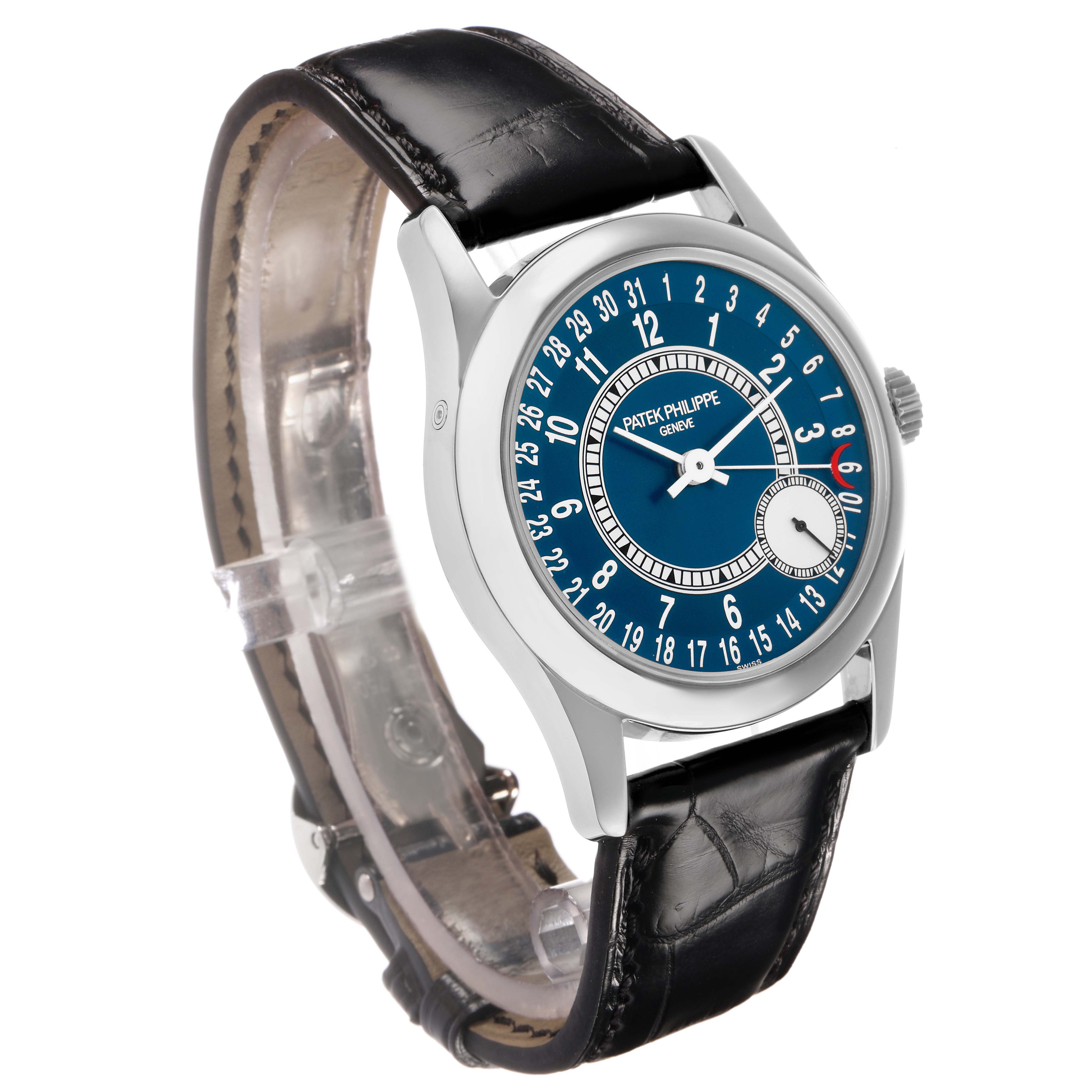 The Patek Philippe Calatrava 6000G Men
s White Gold Blue Dial watch is shown at a slight angle, featuring a blue dial, leather strap, and visible crown.