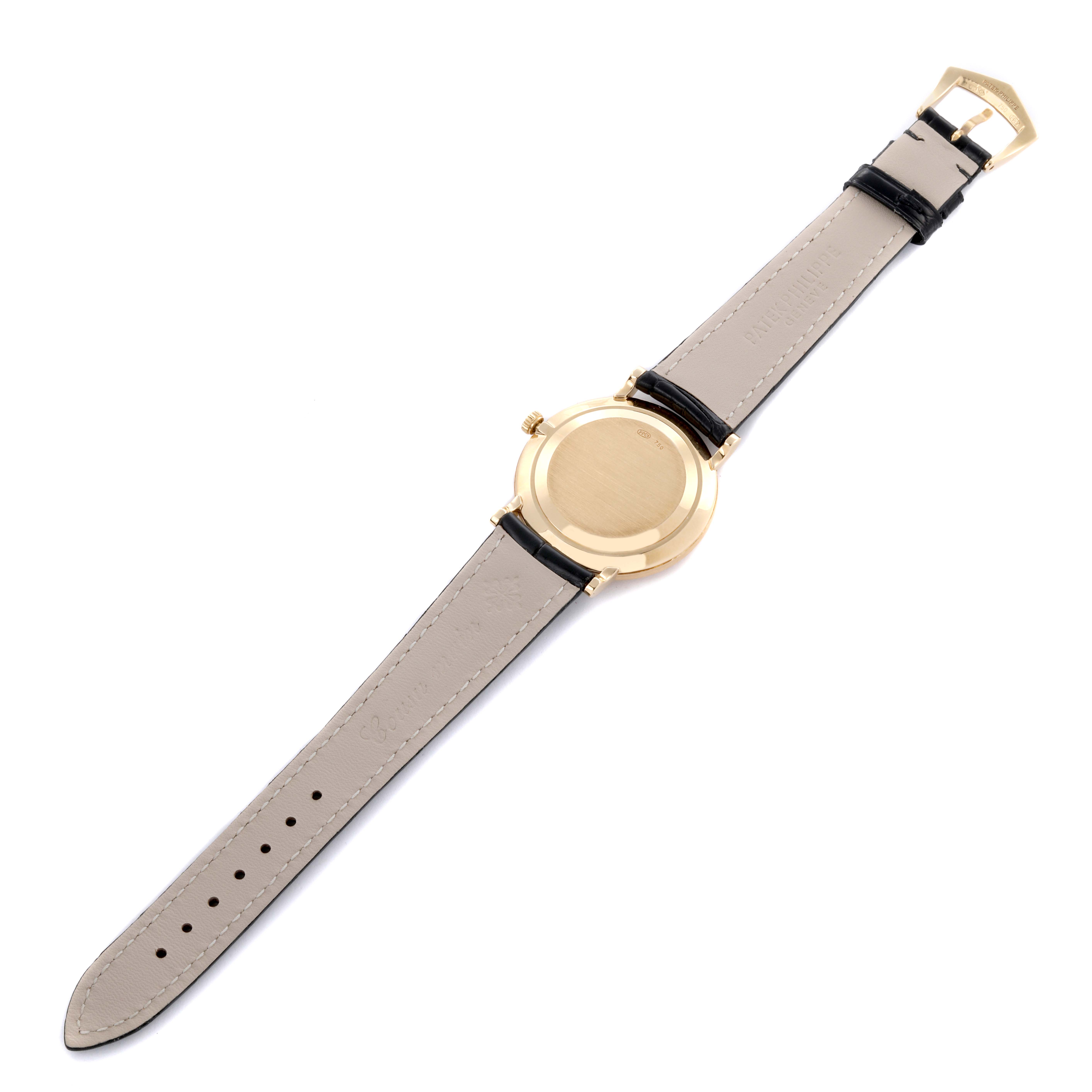 The image shows the back view of a Patek Philippe Calatrava 3919J Men's Yellow Gold White Dial 3919J Men's Yellow Gold White Dial watch, highlighting the case and leather strap.