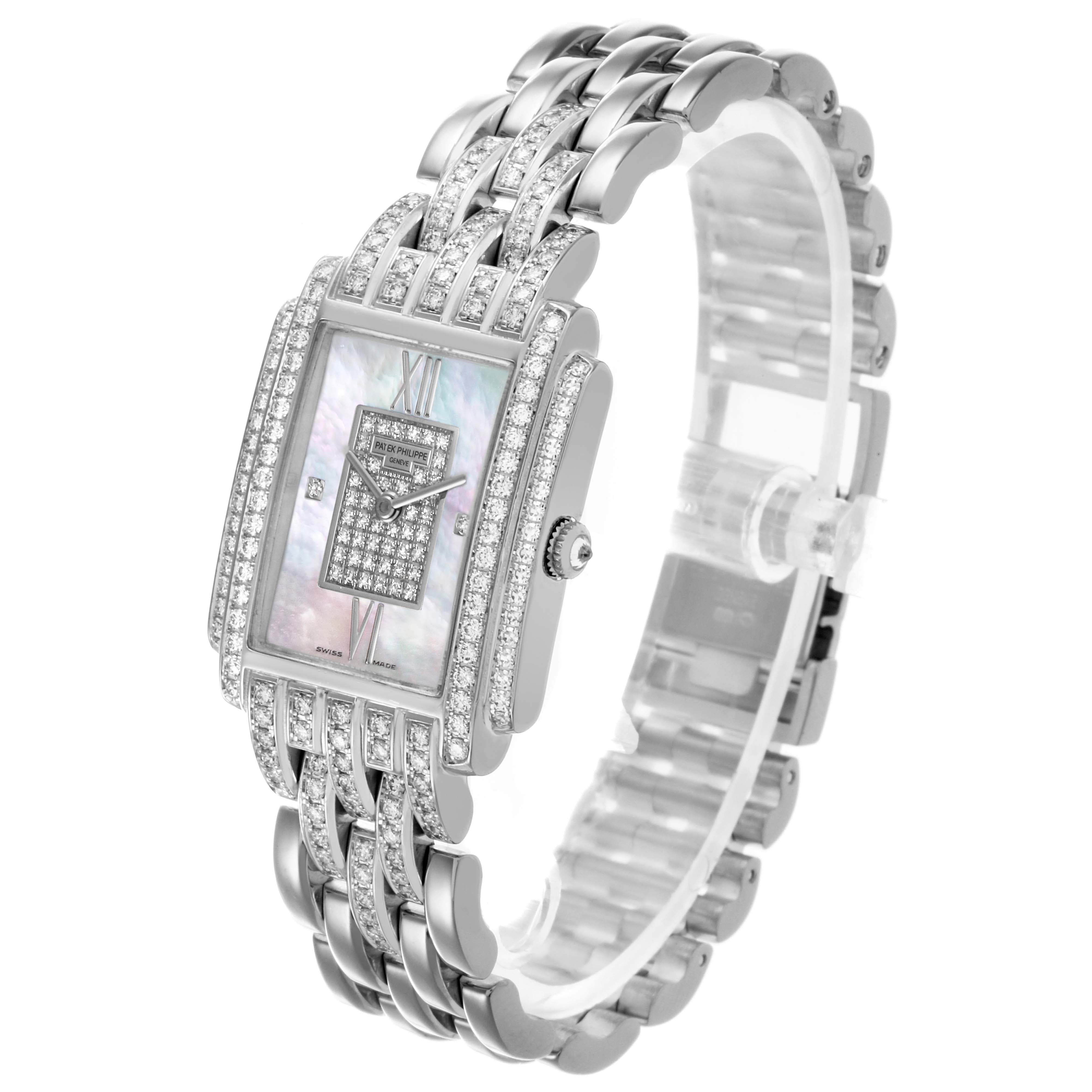 The Patek Philippe Gondolo 4825G/120G-001 Women's White Gold Mother of Pearl Dial 4825G/120G-001 Women's White Gold Mother of Pearl Dial watch is shown at a three-quarter angle, highlighting its rectangular face and diamond-set bracelet.