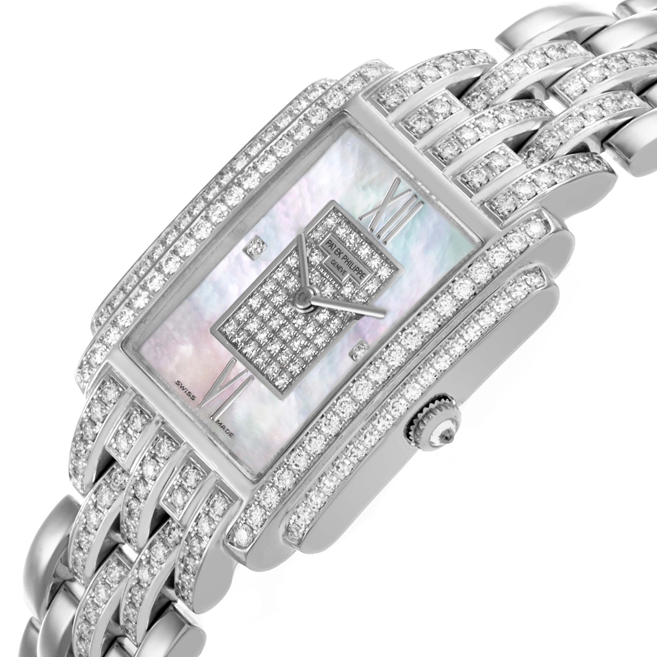 The Patek Philippe Gondolo 4825G/120G-001 Women's White Gold Mother of Pearl Dial 4825G/120G-001 Women's White Gold Mother of Pearl Dial watch is shown at an angled view, highlighting the diamond-studded face, case, and bracelet.