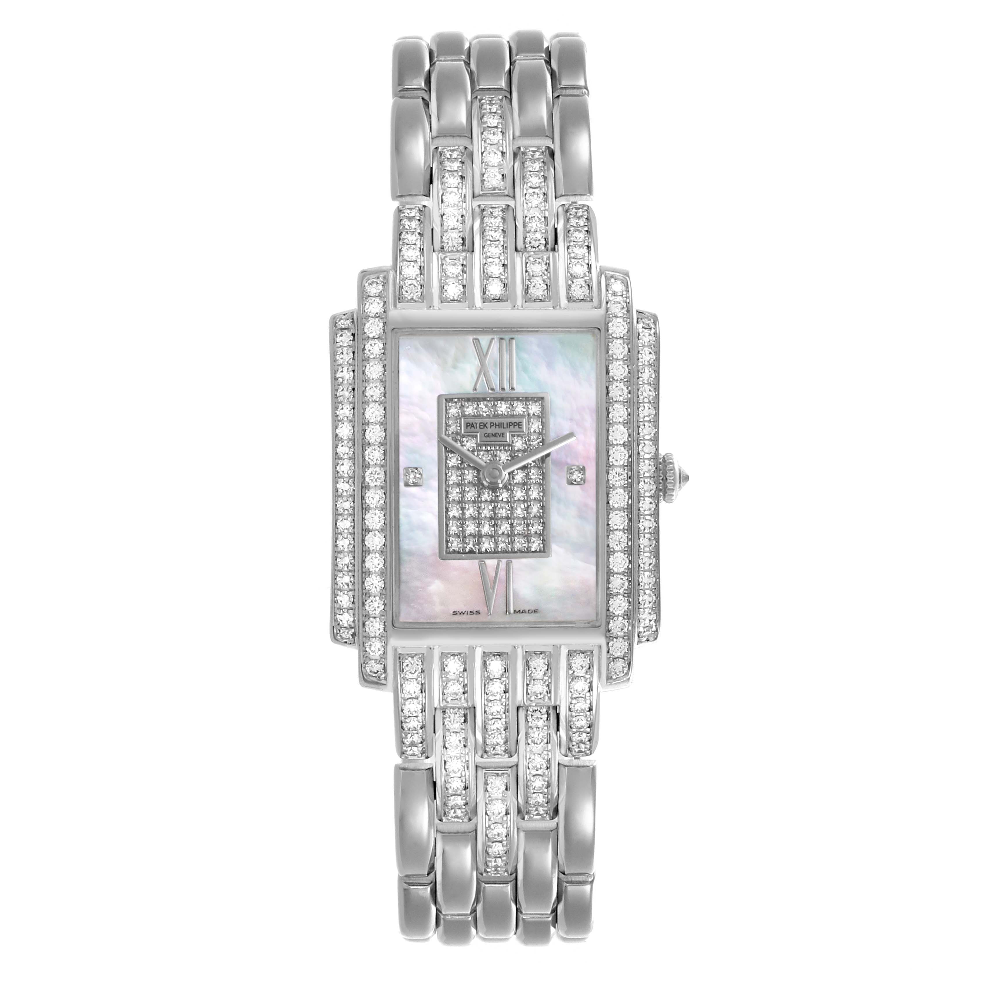 The Patek Philippe Gondolo 4825G/120G-001 Women's White Gold Mother of Pearl Dial 4825G/120G-001 Women's White Gold Mother of Pearl Dial watch is shown from a front angle, displaying its face, bracelet, and diamond embellishments.