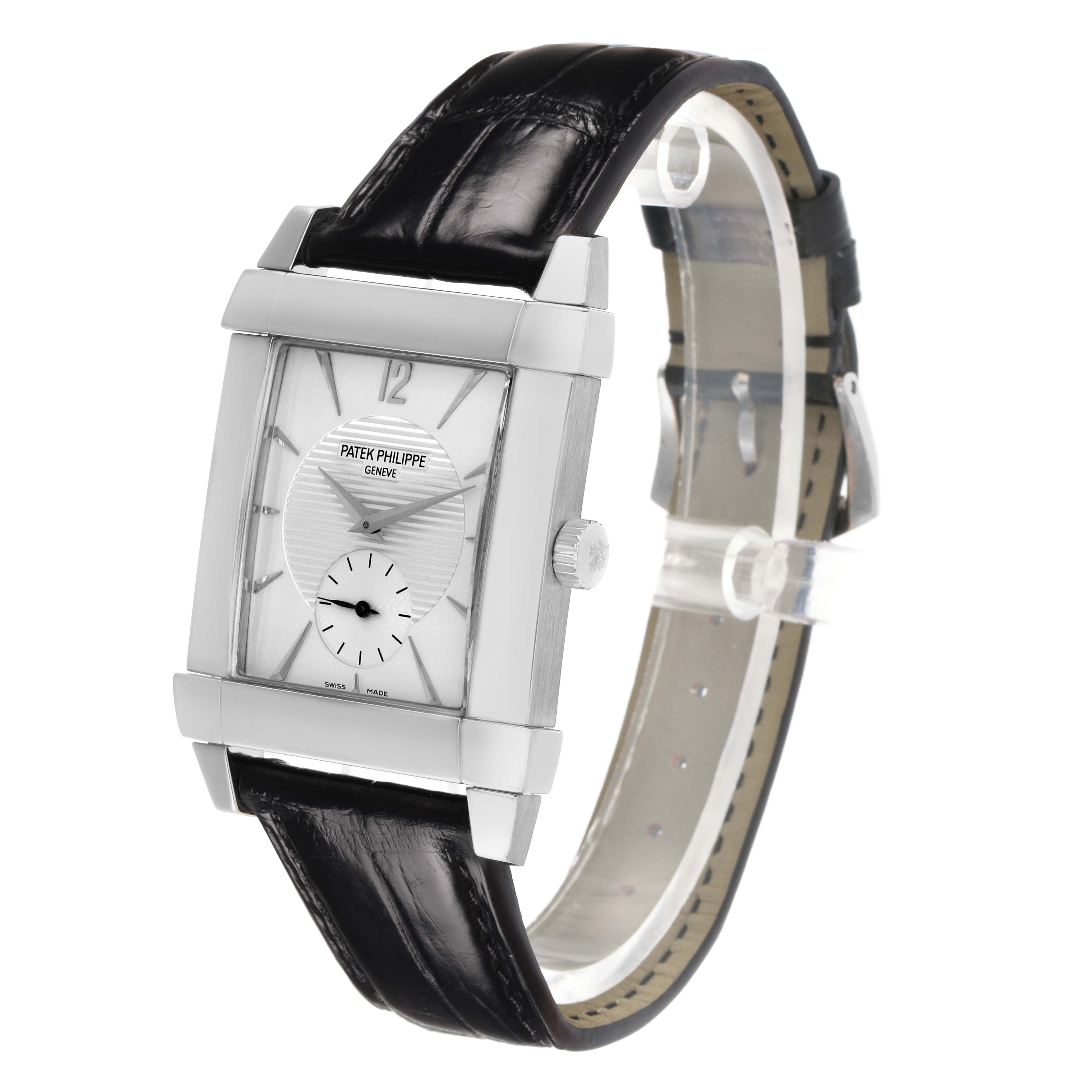 The Patek Philippe Gondolo 5111G-001 Men
s White Gold Silver Dial watch is shown at a slight angle, displaying its rectangular face, crown, and black leather strap.