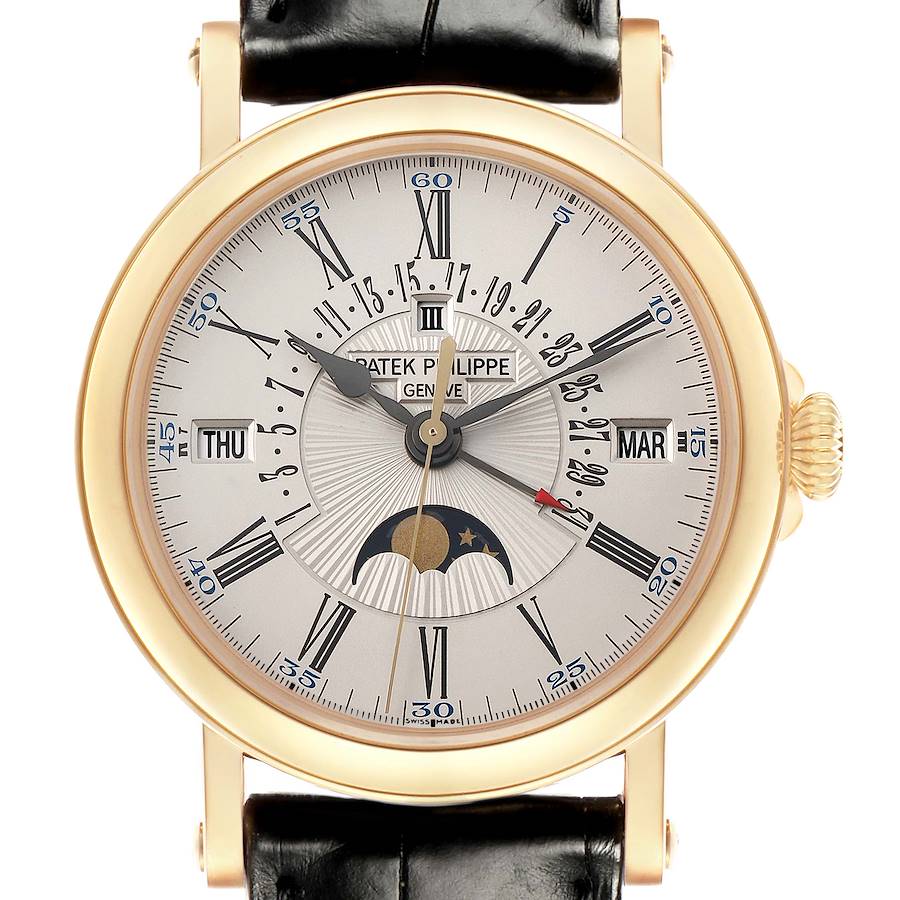 The Patek Philippe Complications 5159J-001 Men's Yellow Gold Silver Dial watch is shown from a front angle, displaying the dial with Roman numerals, moon phase, and date indicators.