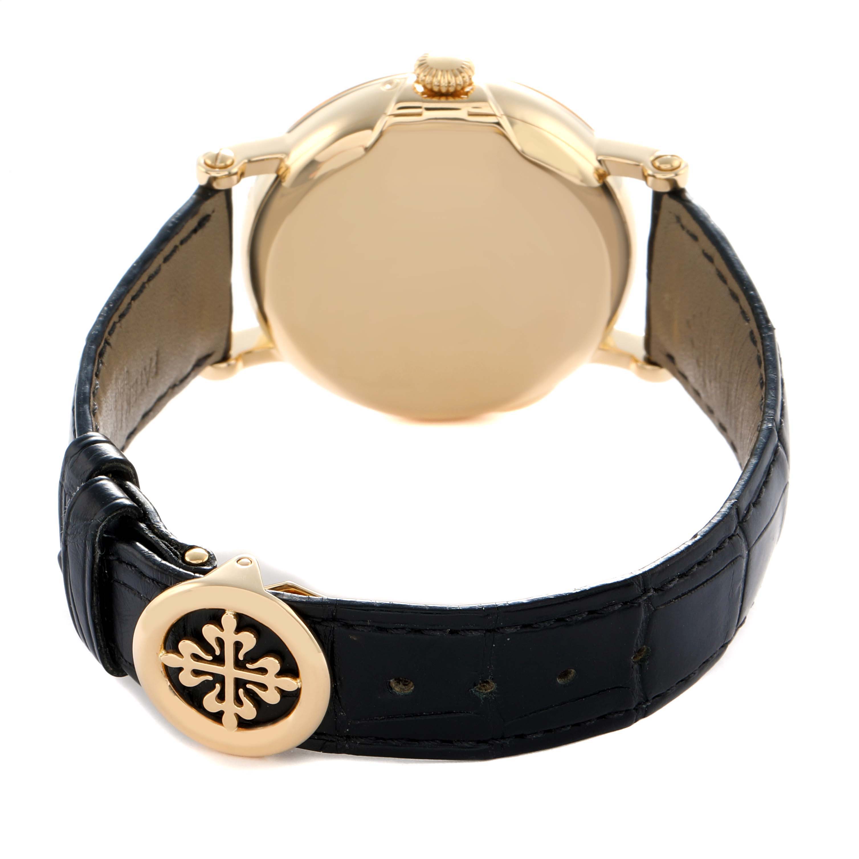 The image shows the back and strap of a Patek Philippe Complications 5159J-001 Men
s Yellow Gold Silver Dial watch, featuring the clasp and case back.