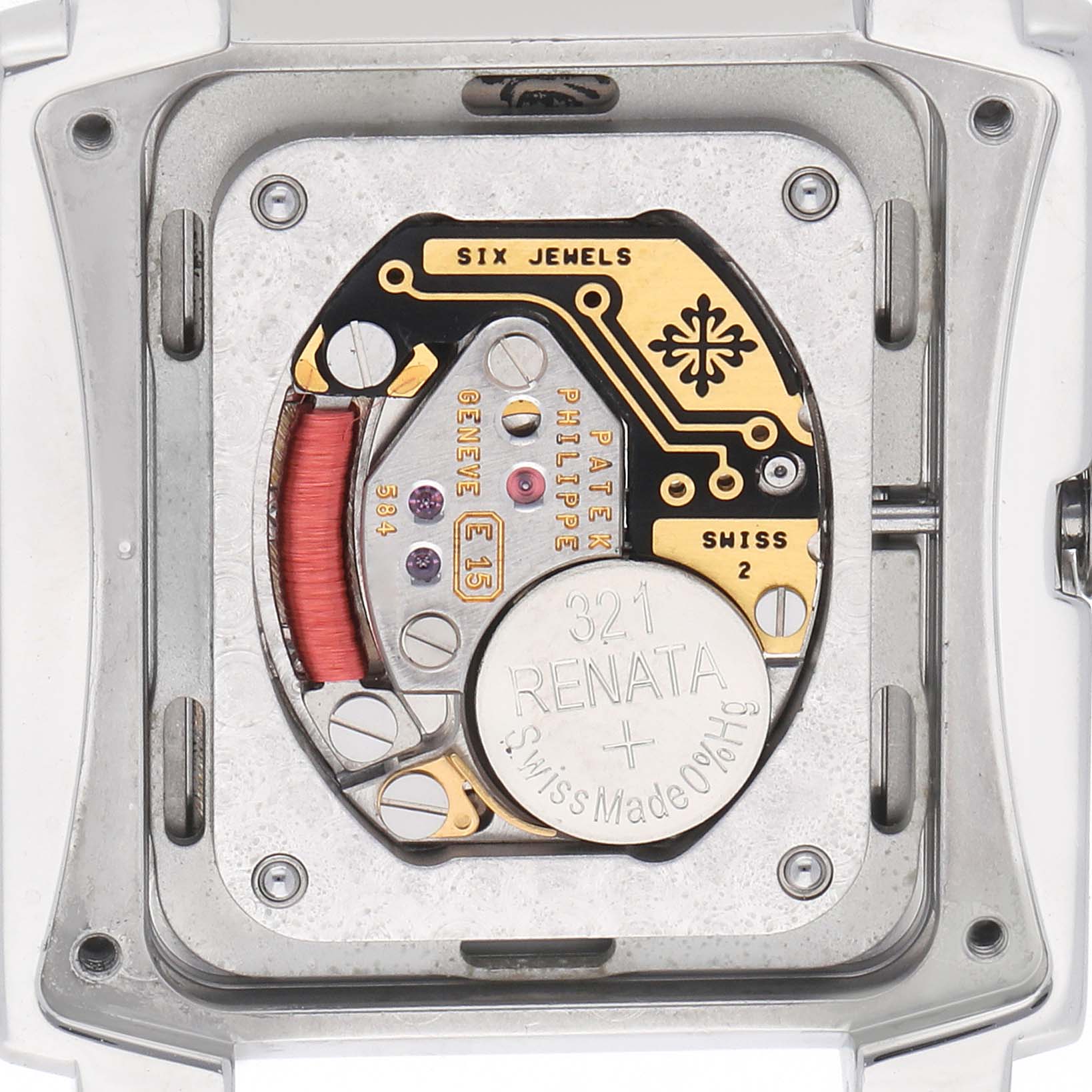 The image shows the back case of a Patek Philippe Twenty-4 4910A Women's Stainless Steel Black Dial, focusing on the movement and battery compartment.