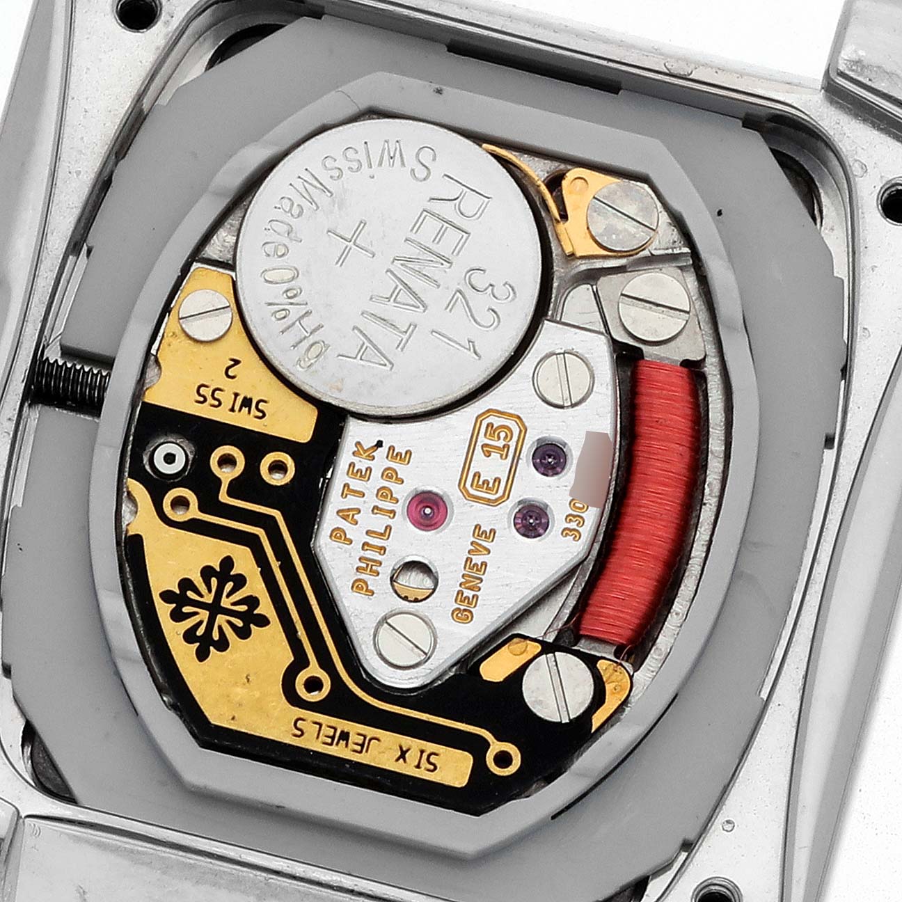 The watch is a Patek Philippe Twenty-4 4908G Women
s White Gold Silver Dial model, shown from the back, displaying its internal movement and battery.