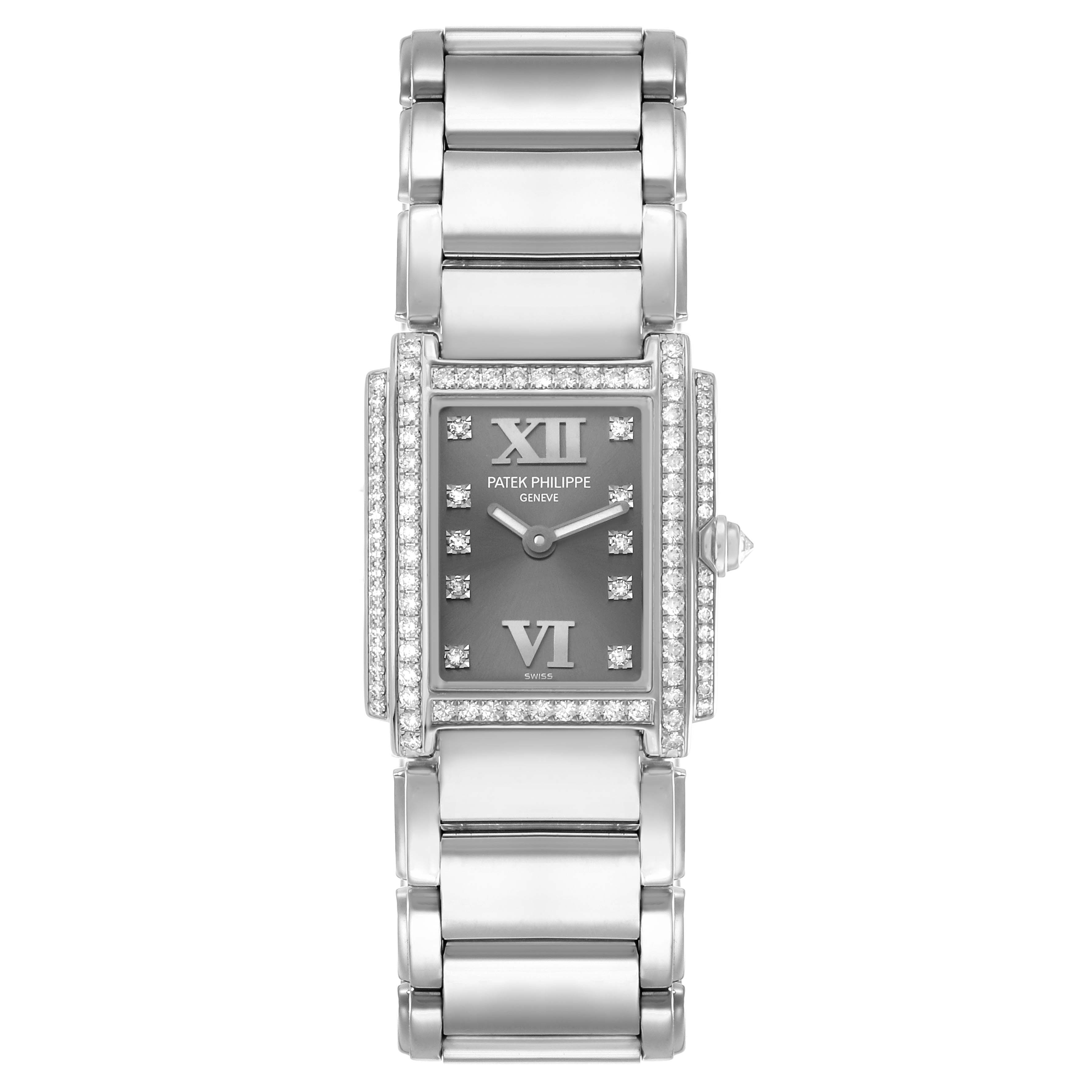 The Patek Philippe Twenty-4 4908G Women
s White Gold Silver Dial watch is shown from a top-down angle, displaying the face and entire bracelet.