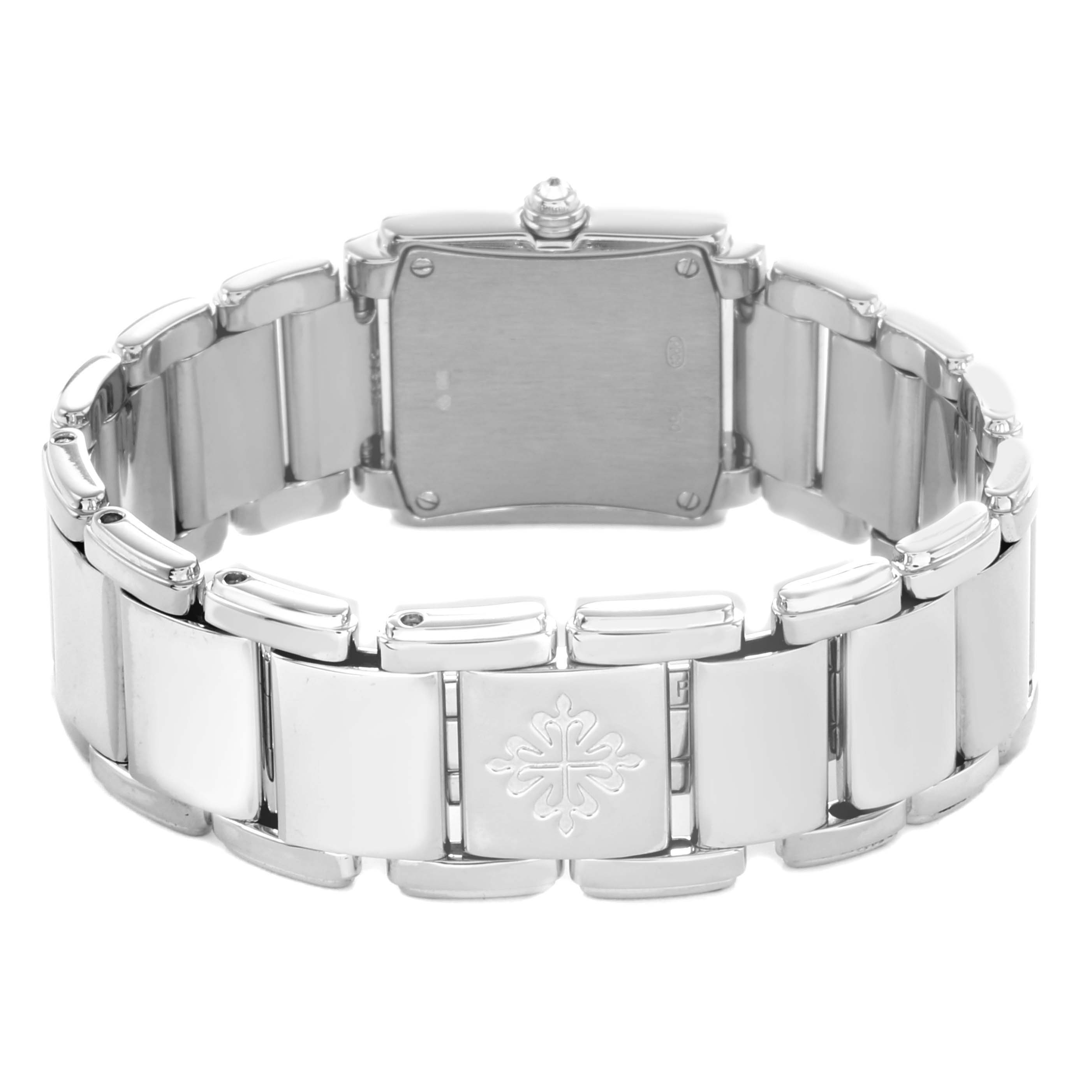 The Patek Philippe Twenty-4 4908G Women
s White Gold Silver Dial watch is shown from the back, highlighting its bracelet and case back.