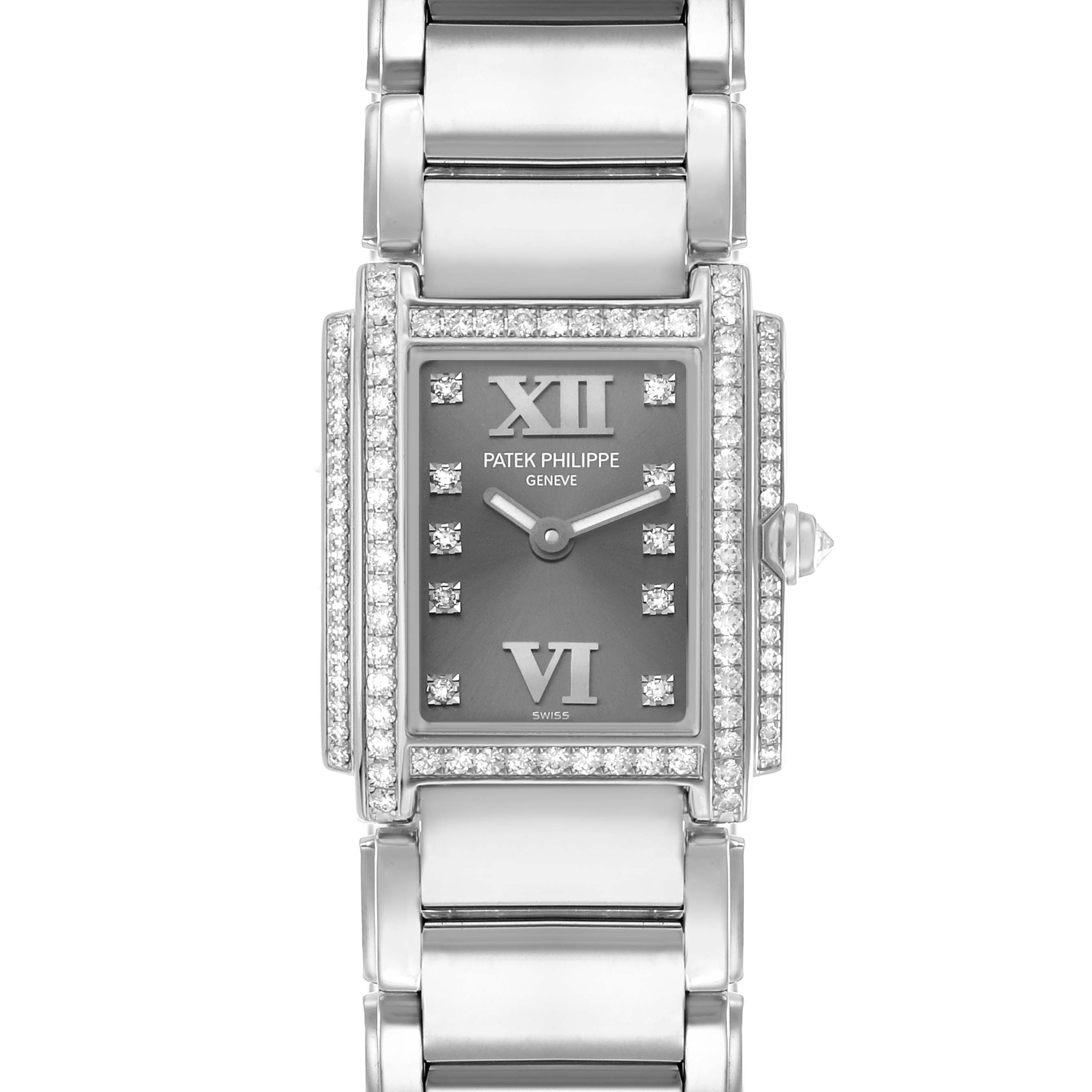 The Patek Philippe Twenty-4 4908G Women
s White Gold Silver Dial watch is shown from a top-down angle, highlighting its face and diamond-encrusted bezel.