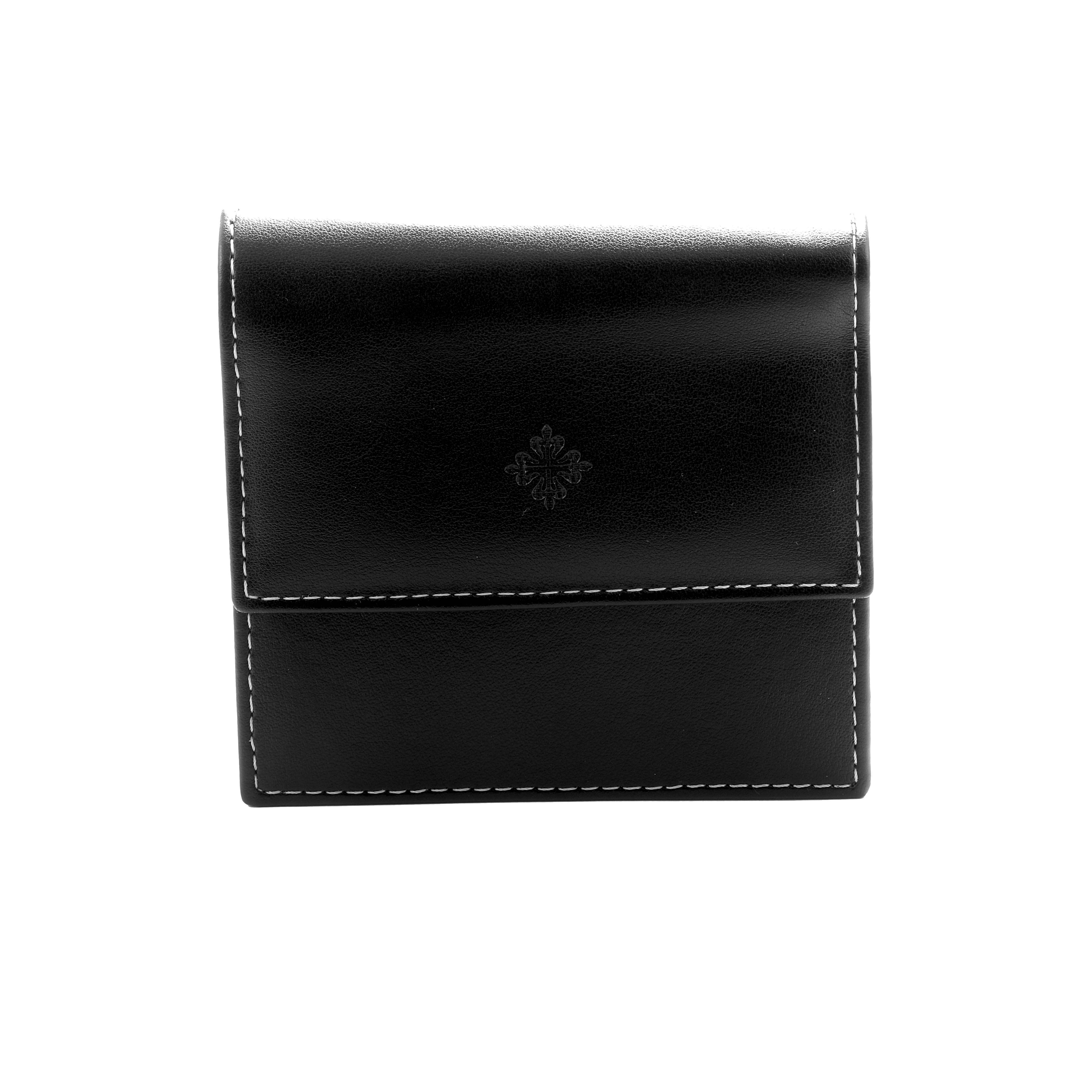 This is a black leather case for the Patek Philippe Twenty-4 4910/20G-001 Women's White Gold Silver Dial watch, shown from the front with decorative stitching.