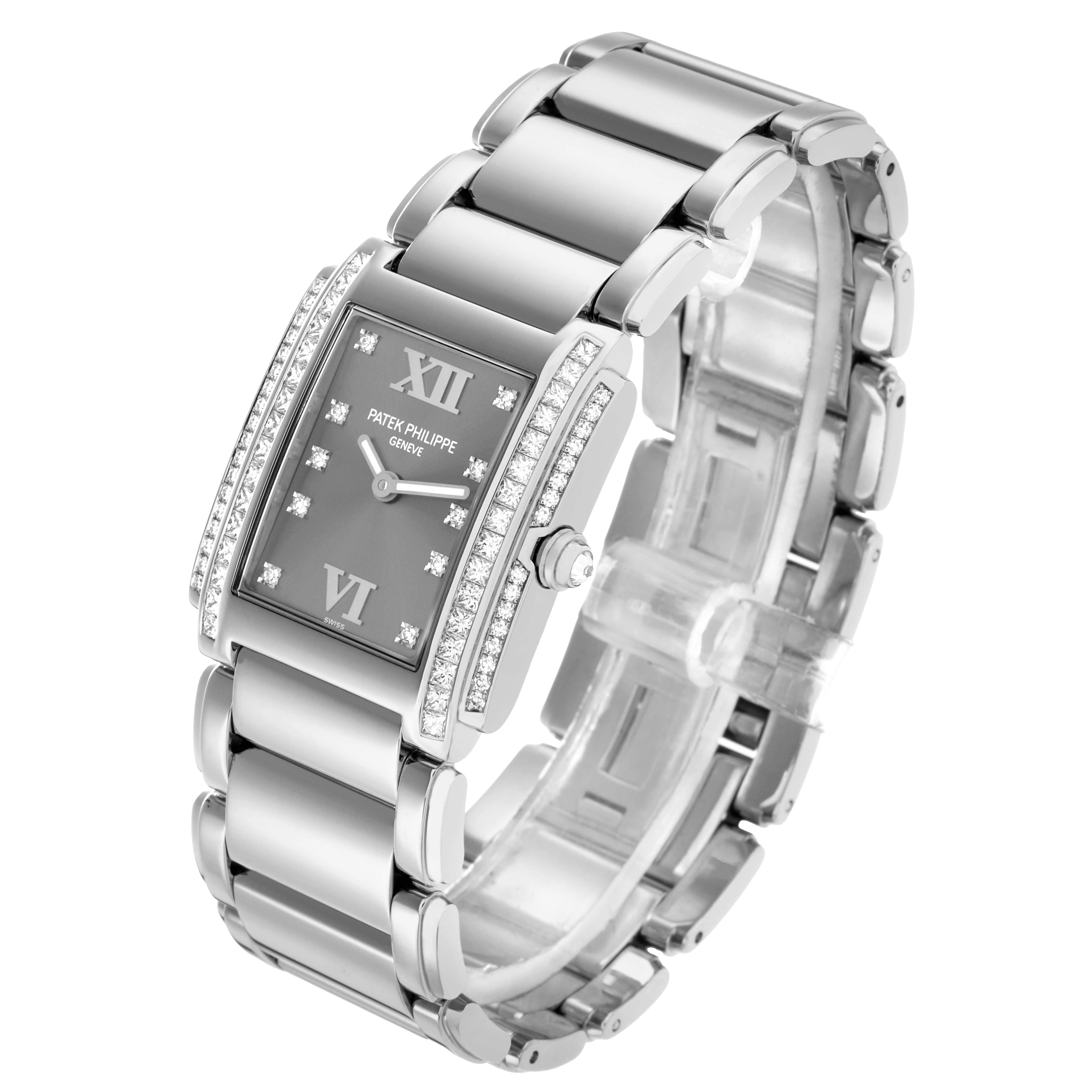 The Patek Philippe Twenty-4 4910/20G-001 Women's White Gold Silver Dial watch is shown at a three-quarter angle highlighting the dial, bracelet, and crown.