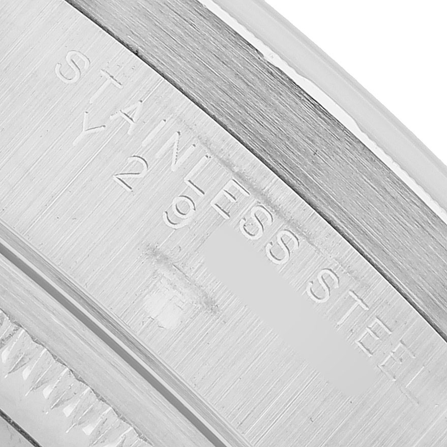 The image shows a close-up of the inner case edge of a Rolex Air-King 14010 Men's Stainless Steel Pink Dial, displaying "STAINLESS STEEL" engraving.