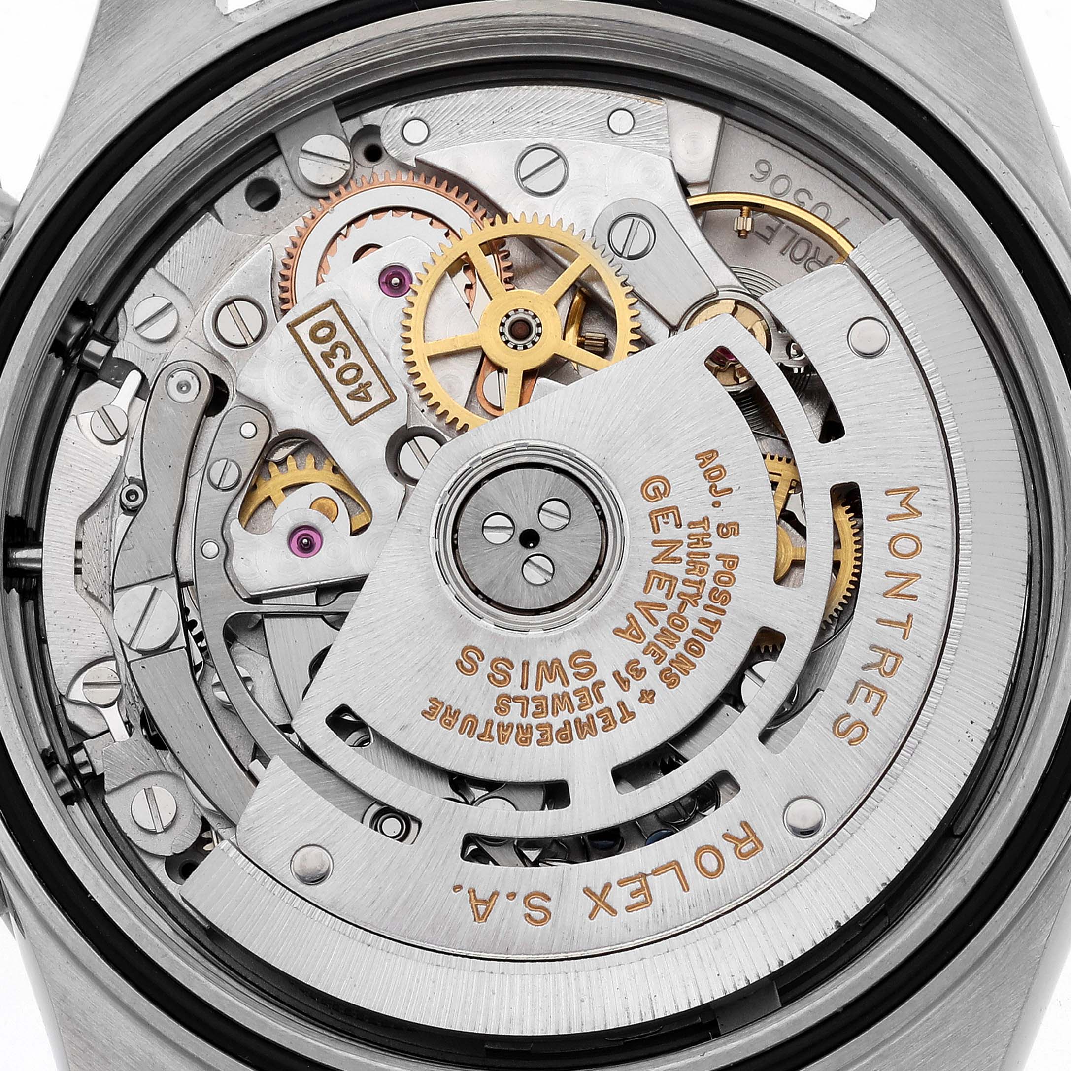 The image shows the intricate movement of a Rolex Daytona 16520 Men's Stainless Steel White Dial 16520 Men's Stainless Steel White Dial watch from a rear view, highlighting its mechanical components.