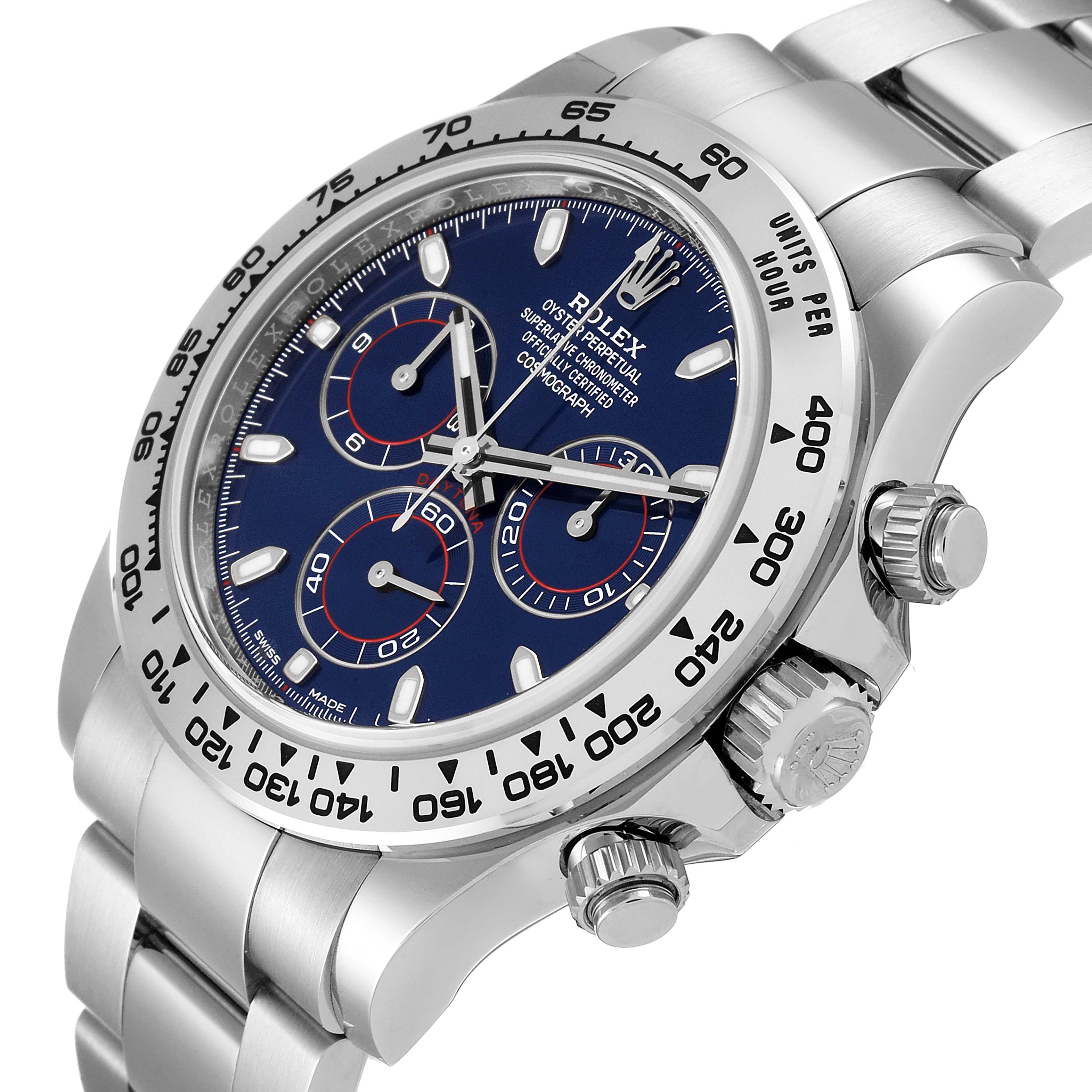 The Rolex Daytona 116509 Men's White Gold Blue Dial 116509 Men's White Gold Blue Dial watch is shown at an angle that highlights its face, bezel, and crown, with a focus on the dial and pushers.