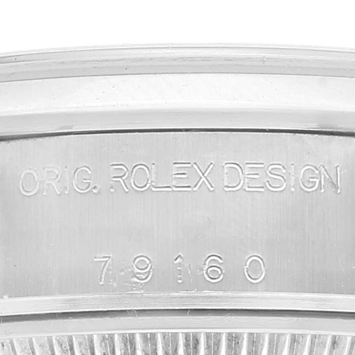 This image shows a close-up of the case side of a Rolex Date 79160 Women's Stainless Steel Pink Dial 79160 Women's Stainless Steel Pink Dial model, highlighting the "ORIG. ROLEX DESIGN" and model number engravings.