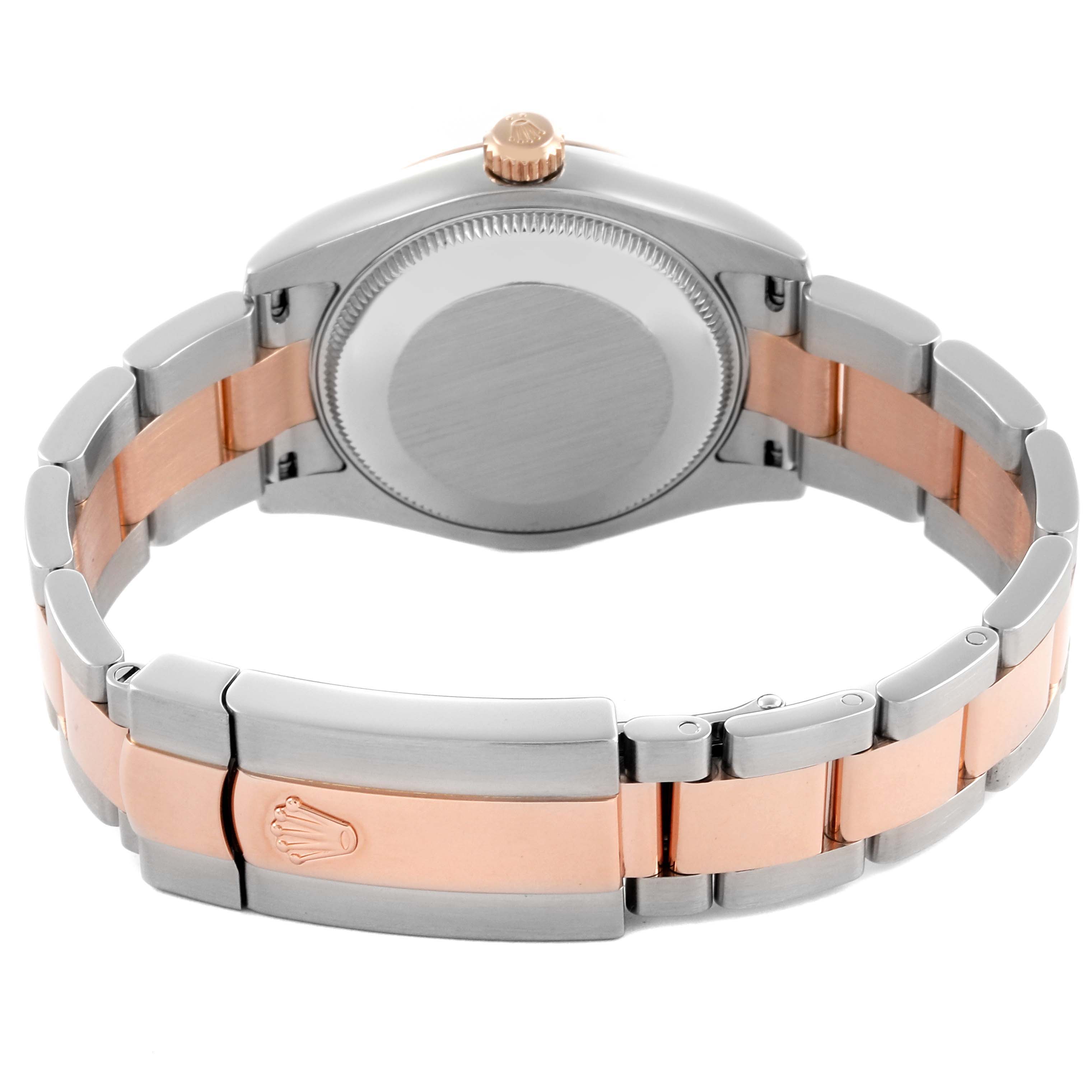 This image shows the back and bracelet of a Rolex Mid-Size 178241 Women's Steel and Gold (two tone) Pink Dial 178241 Women's Steel and Gold (two tone) Pink Dial watch from a top angle.