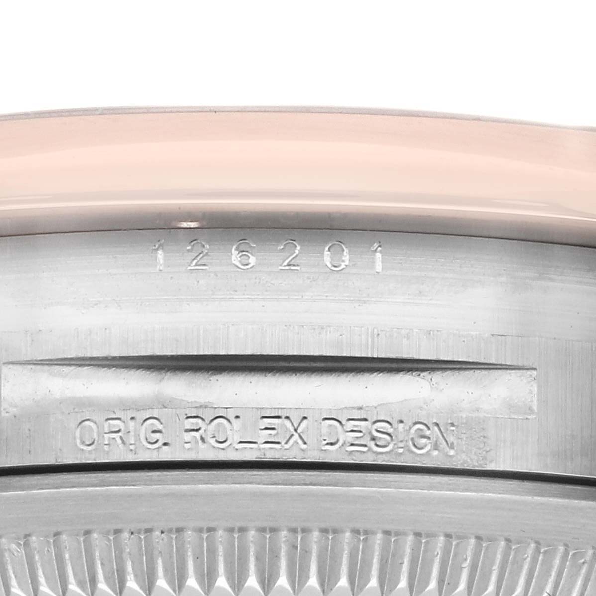The image shows the side view of a Rolex Datejust 126201 Men's Steel and Gold (two tone) White Dial 126201 Men's Steel and Gold (two tone) White Dial case with engraved markings.